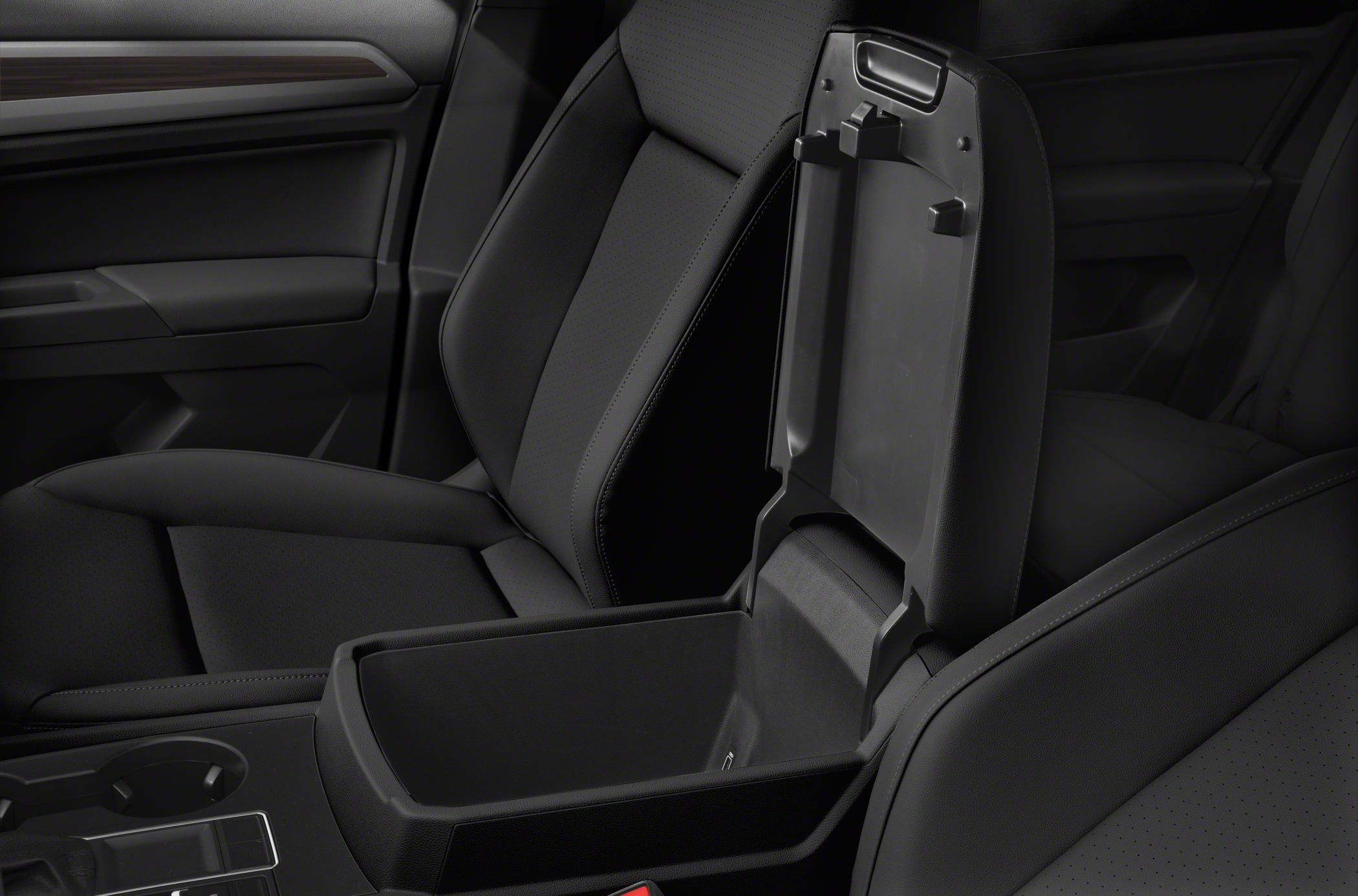 Center console storage compartment with armrest in black upholstery