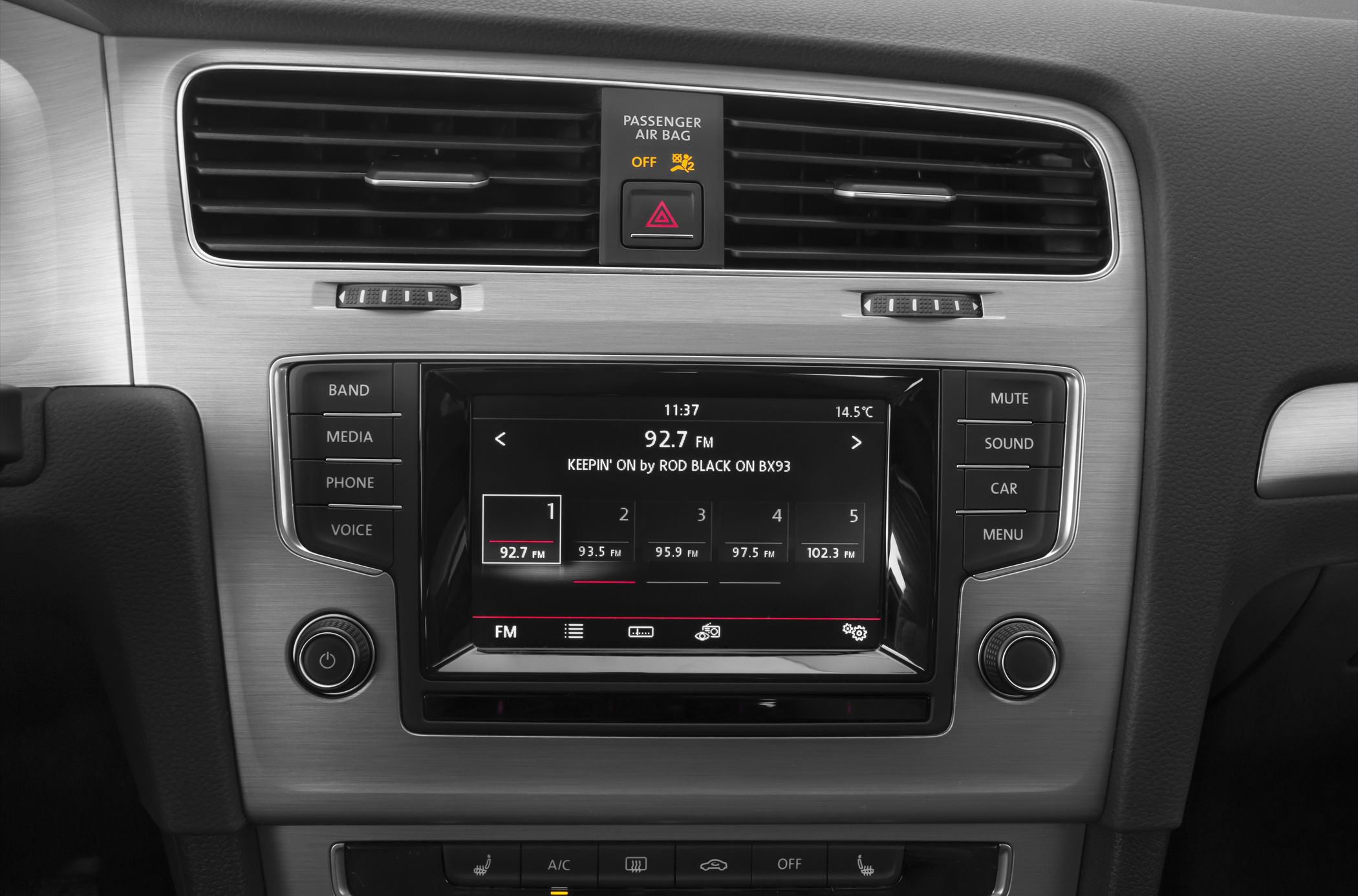 Central touchscreen infotainment system and air vents in dashboard