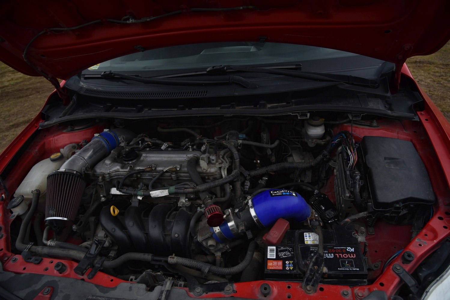 Engine bay with aftermarket air intake system and components