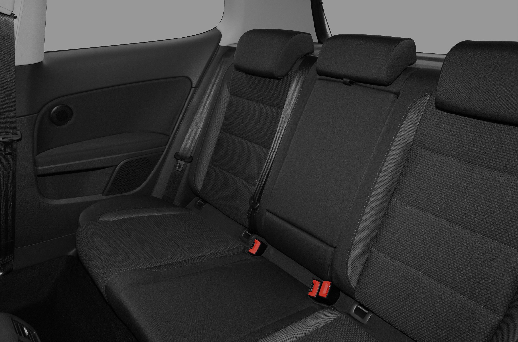 Rear seat upholstery and interior design with headrests and seatbelts.