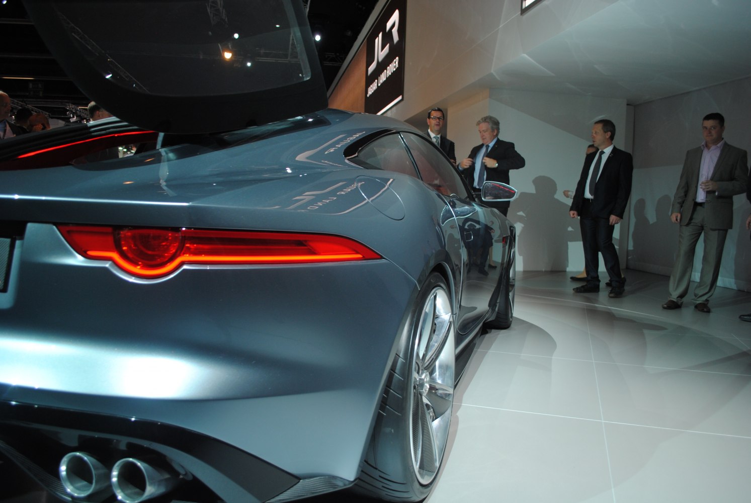 Sleek rear side with illuminated tail light and large alloy wheel