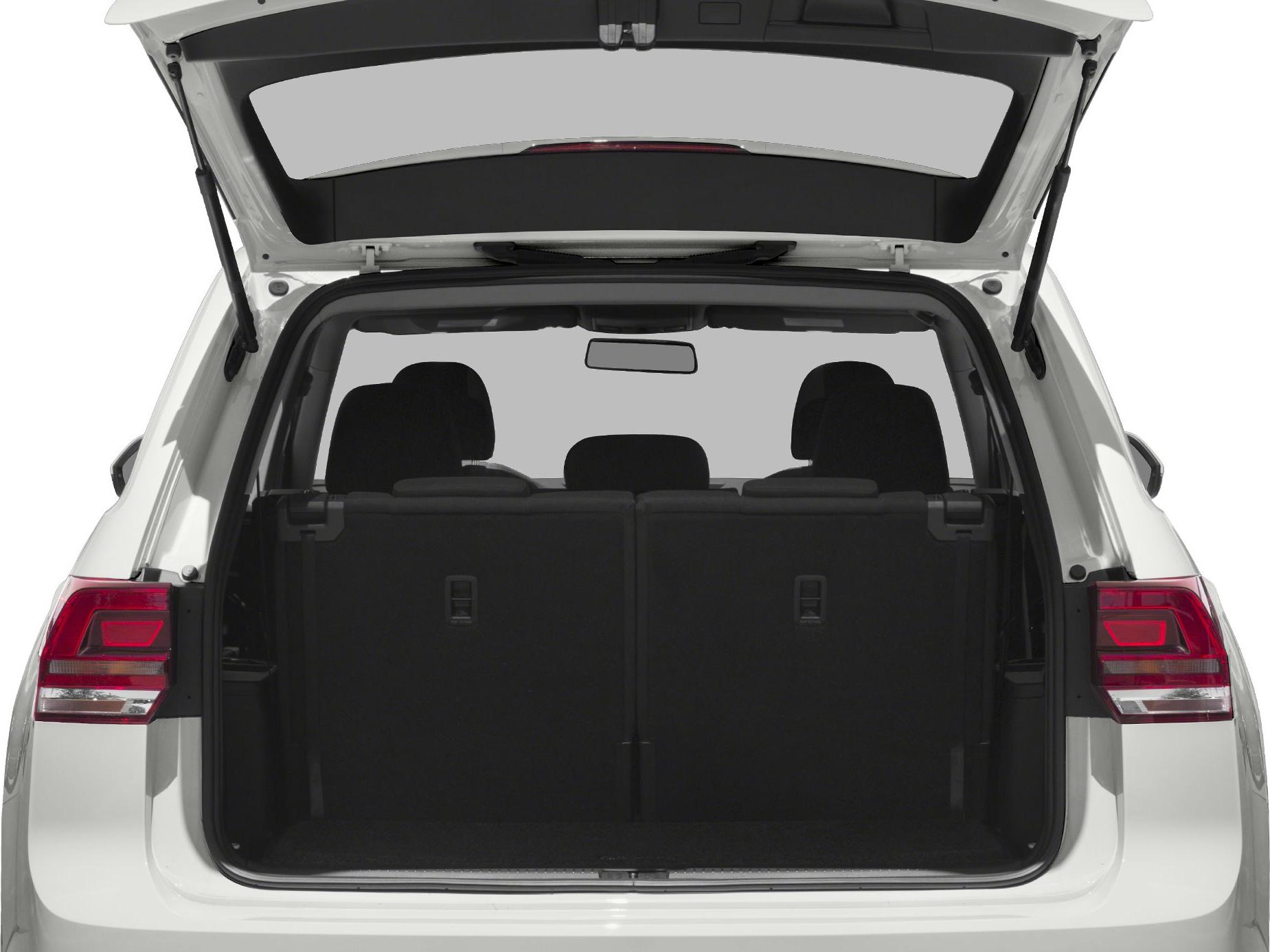 Open rear cargo space with folded rear seats and tailgate lifted