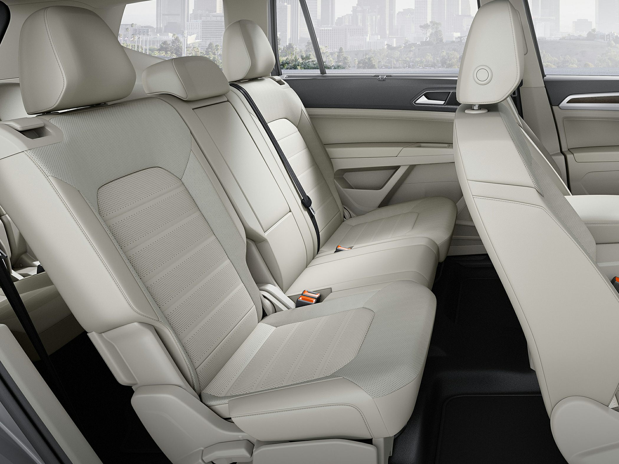 Spacious light leather rear seats with headrests and seatbelt