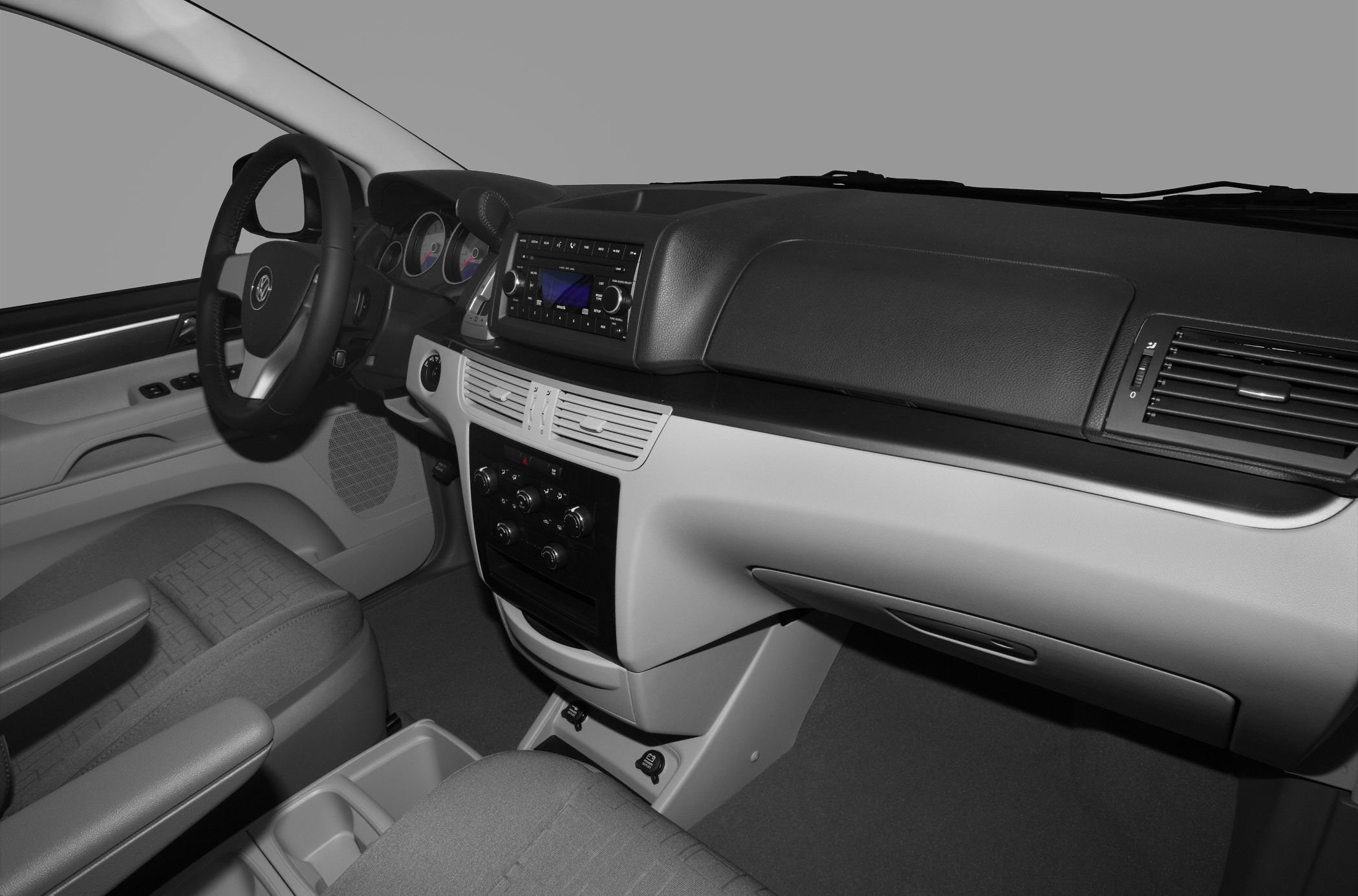 Dashboard, steering wheel, and control panel of a vehicle interior