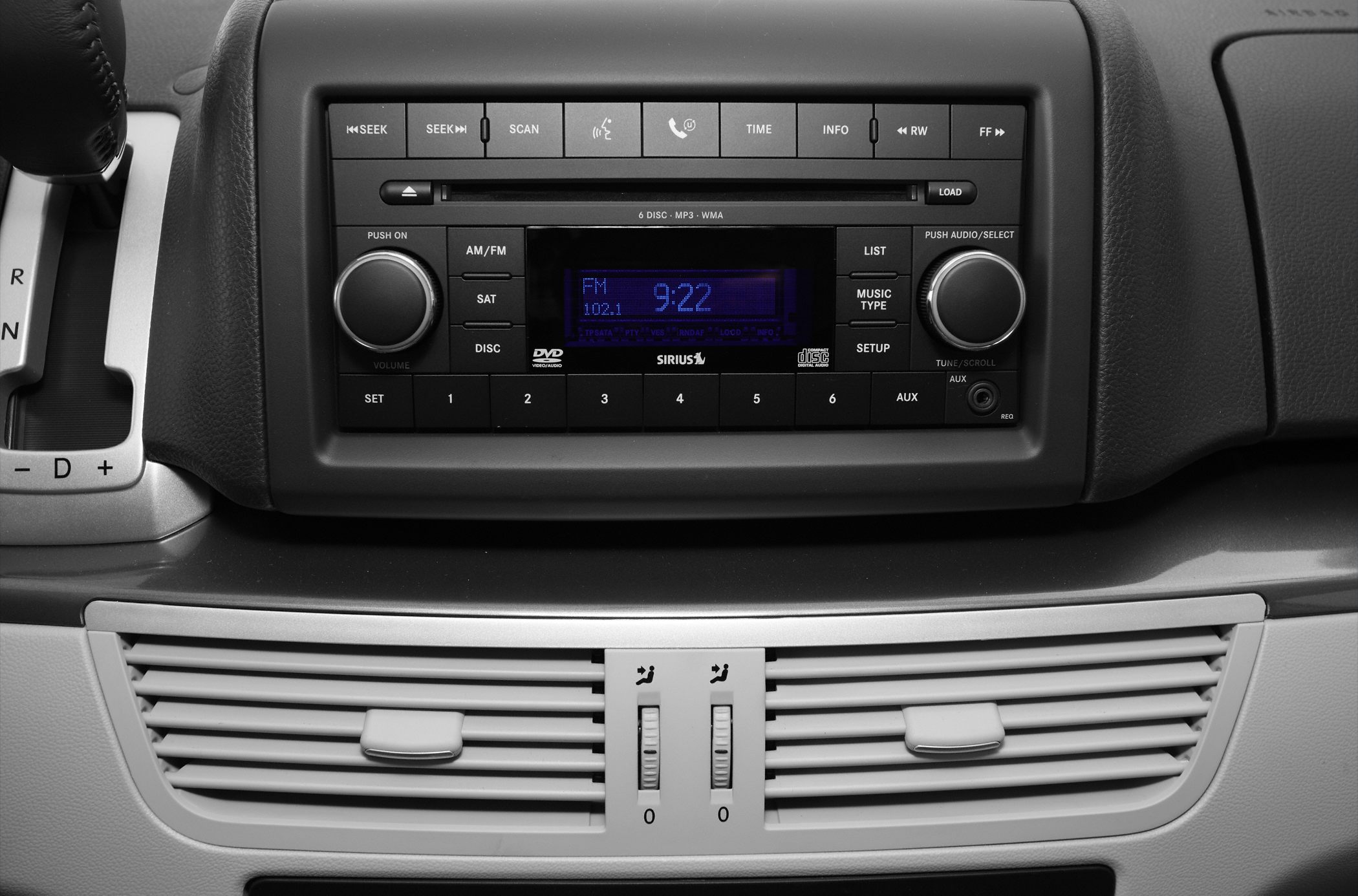 Car audio system with radio, CD player, and dashboard air vents