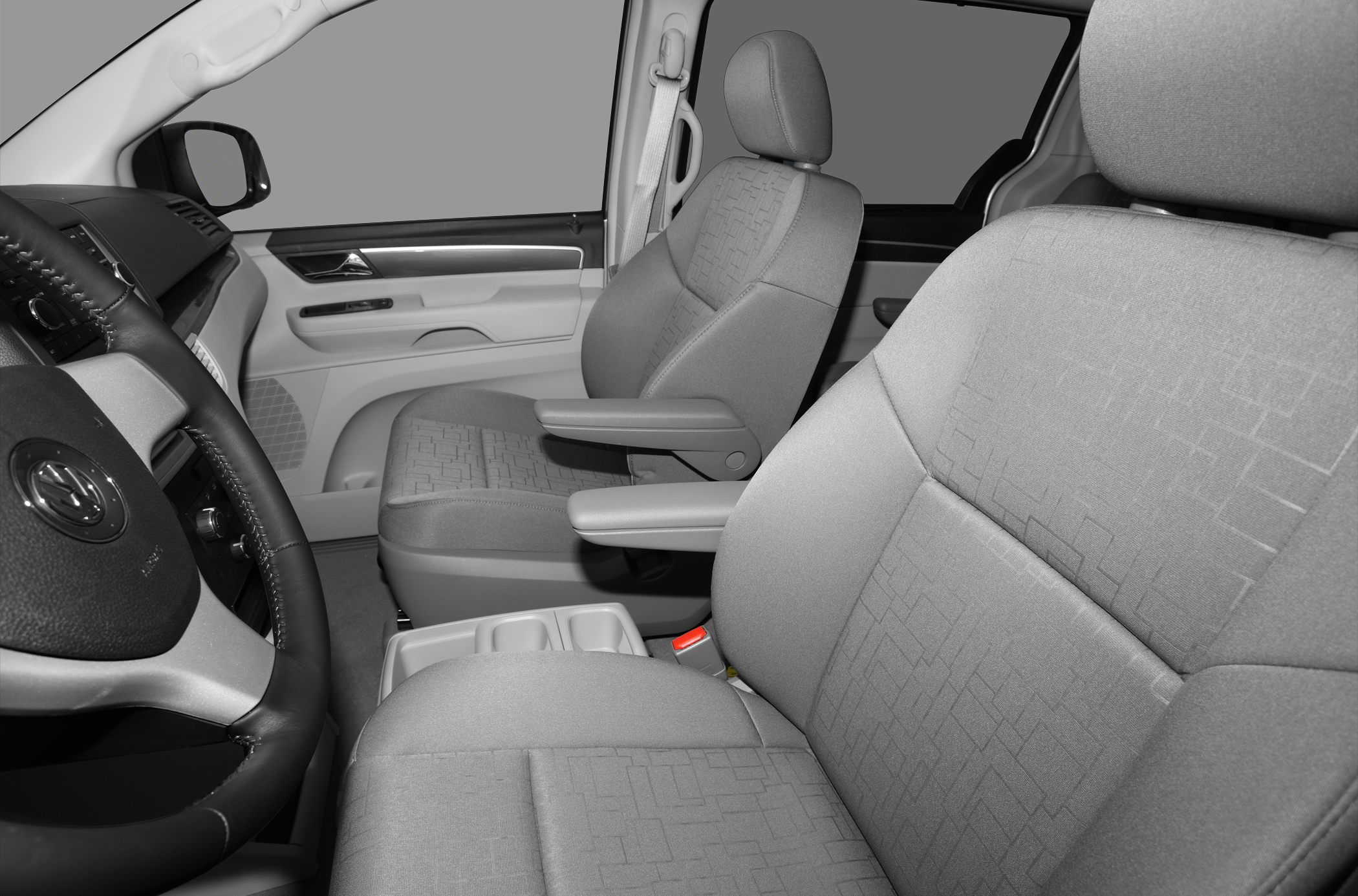 Front fabric seats with armrests and detailed door panel interior