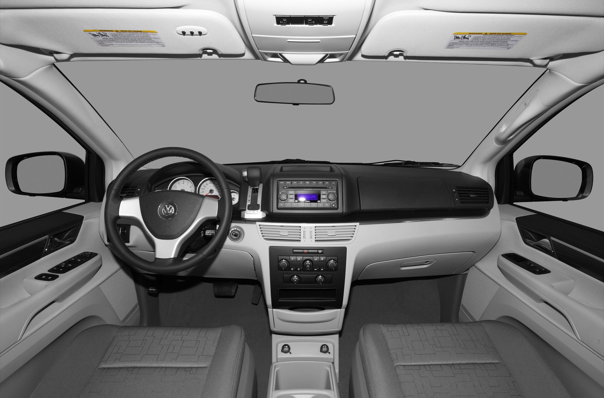 Dashboard and steering wheel view of a 2009 minivan interior