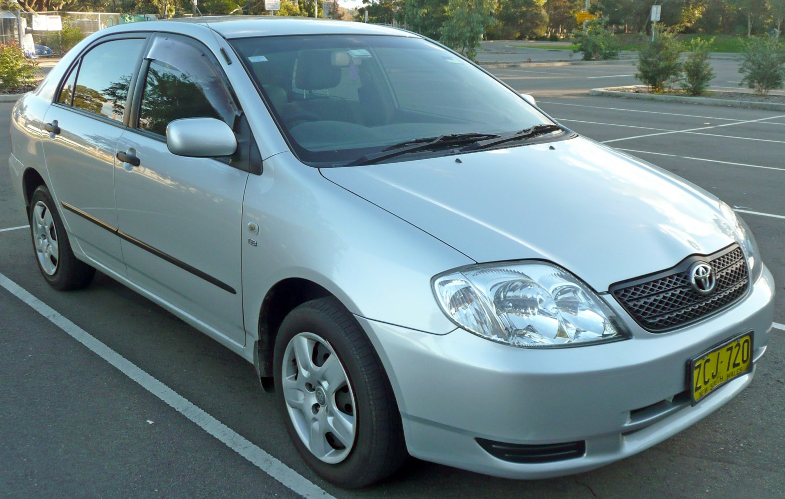 Silver sedan showing front and side exterior with clear headlights and smooth body lines