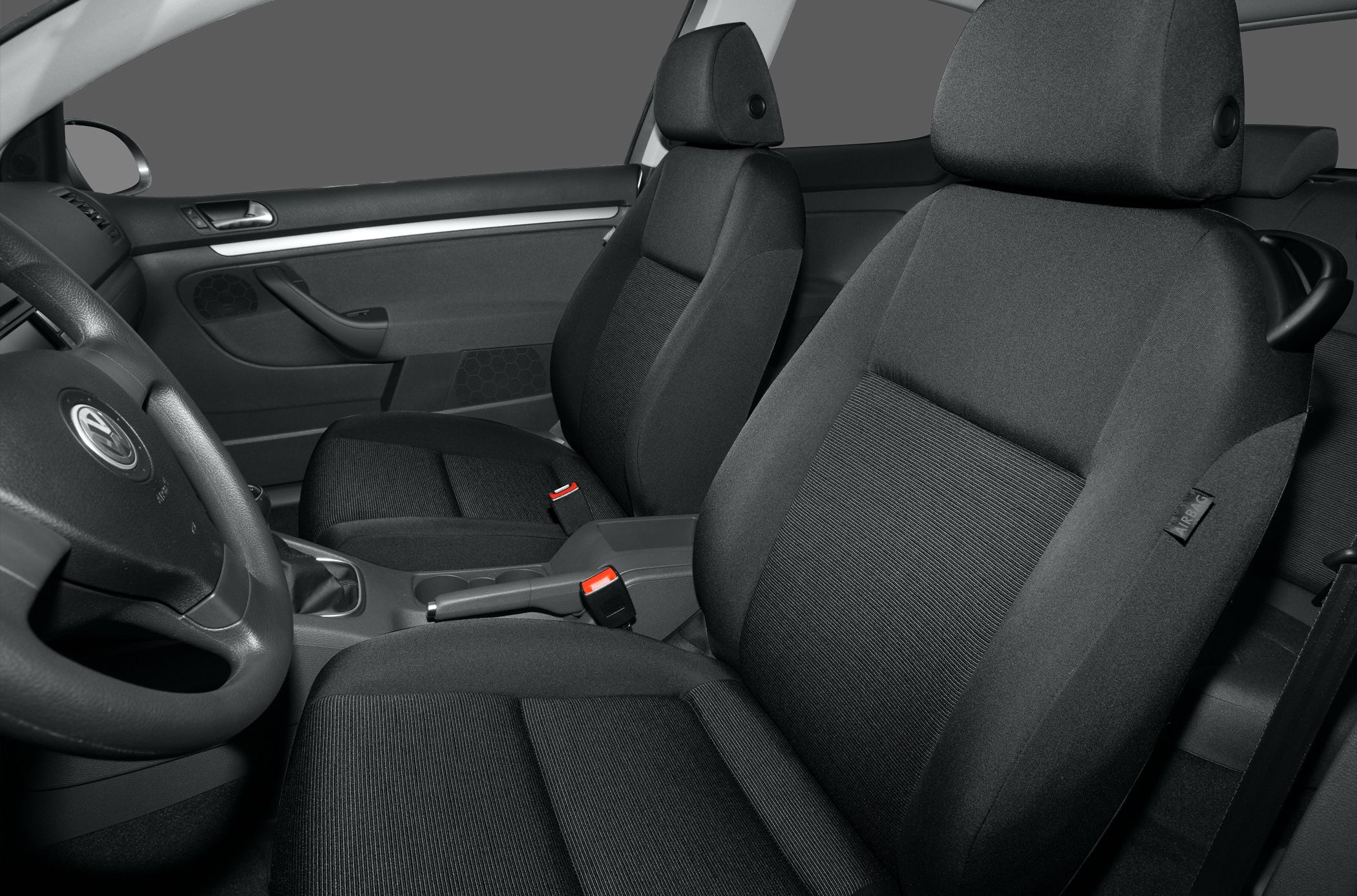 Front fabric seats and dashboard of car interior
