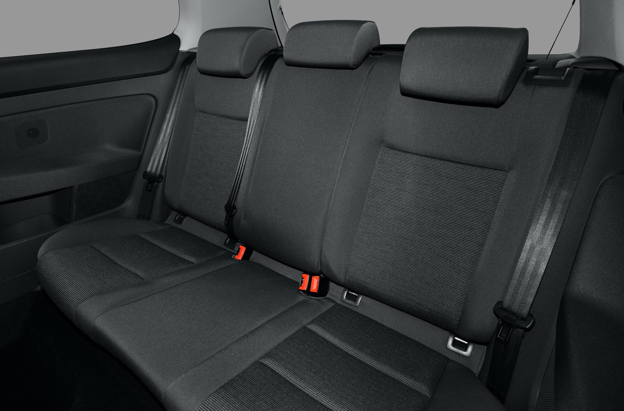 Rear seat with fabric upholstery and three headrests