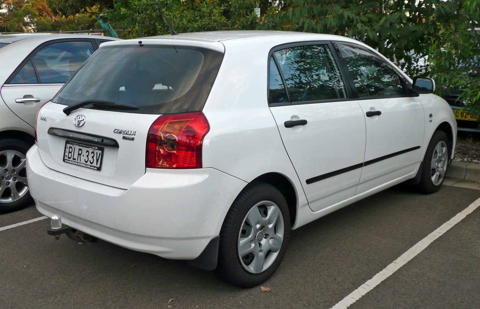 White 5-door hatchback with rear taillights and compact design