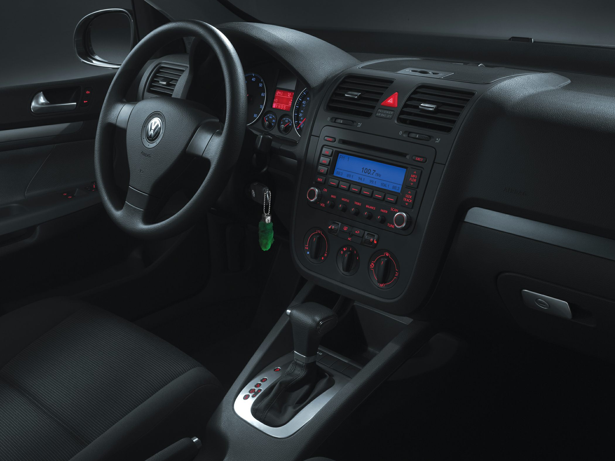 Dashboard, steering wheel, center console with gear shift and radio display