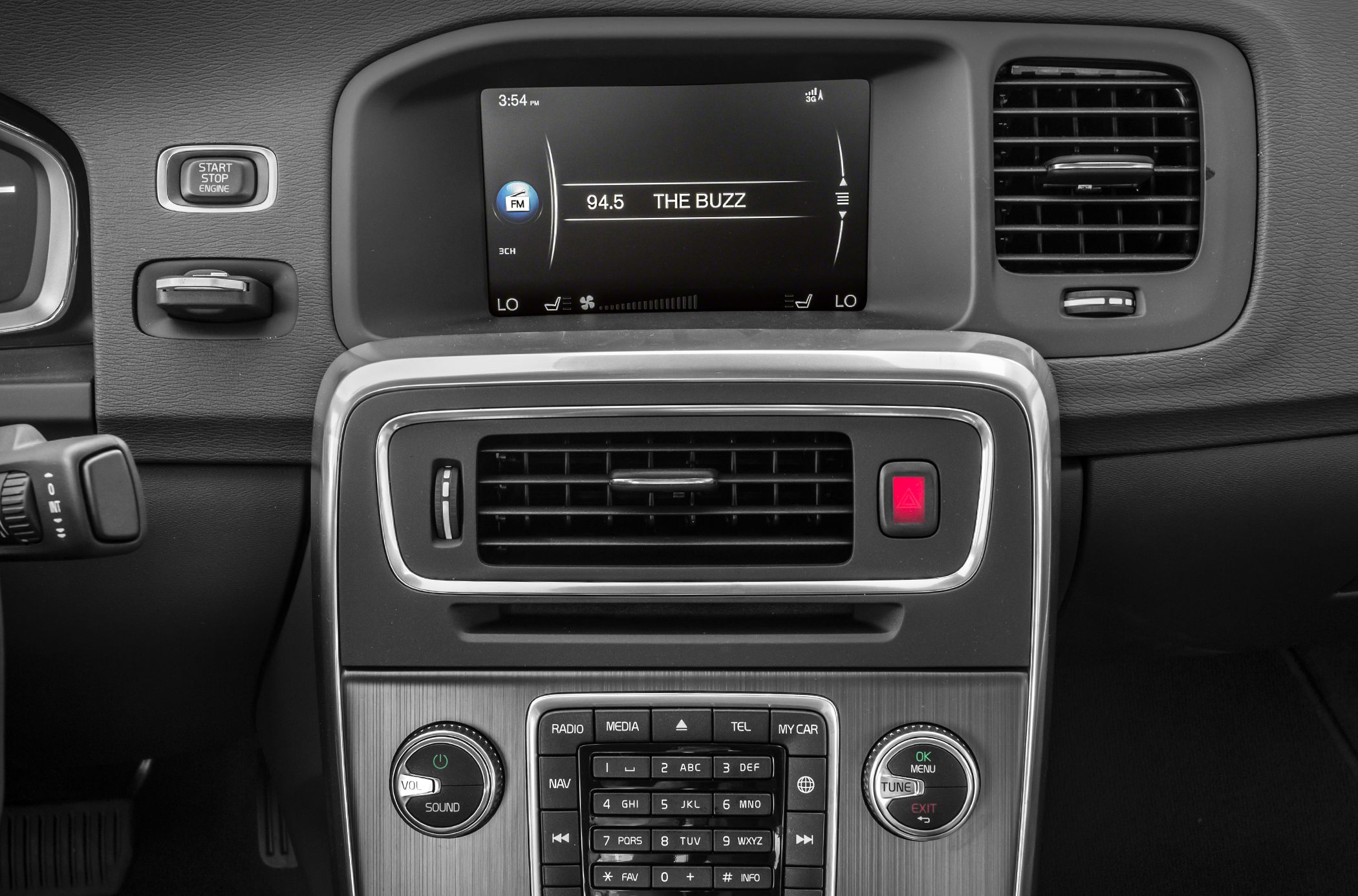 Center console with multimedia display, air vents, and control buttons