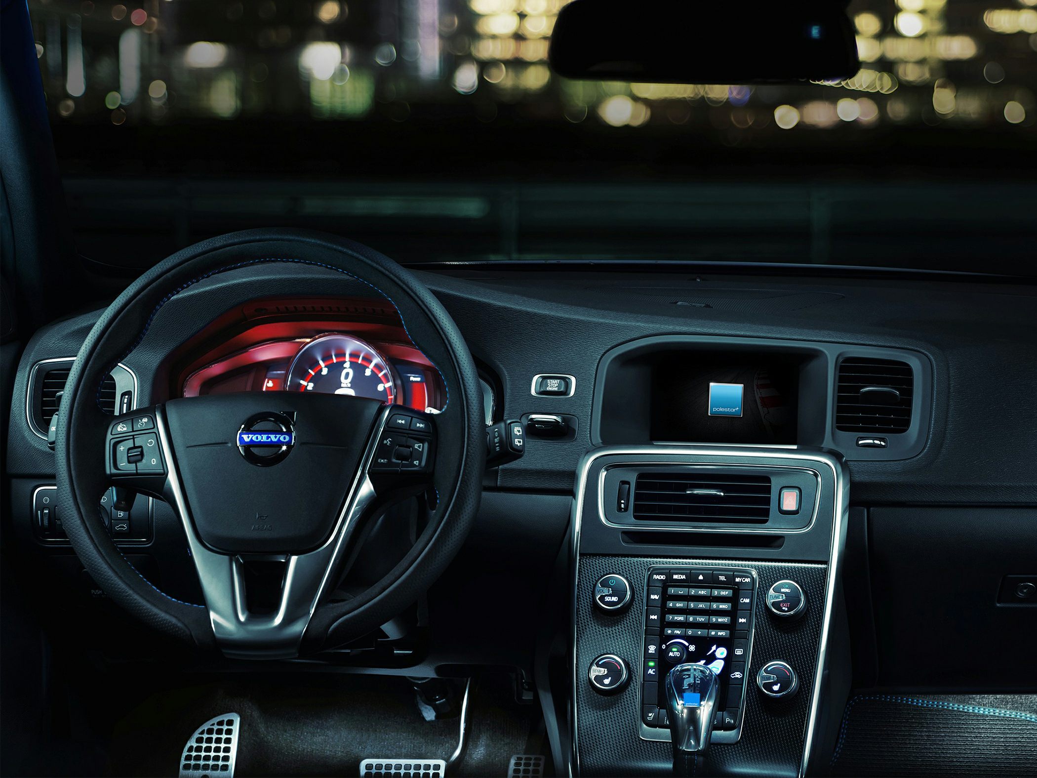 Digital dashboard and center console with steering controls and Polestar display.