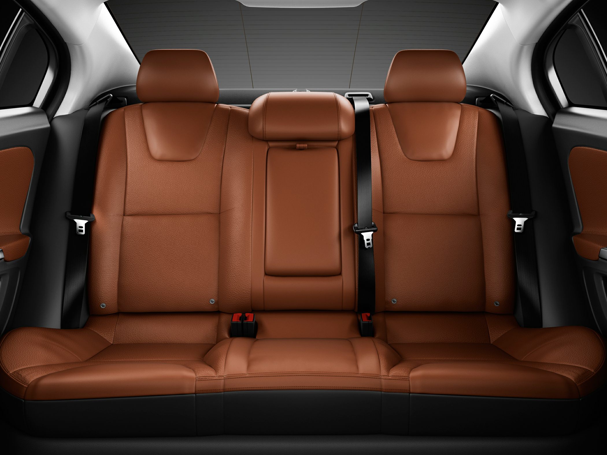 Rear view of brown leather car seats with seat belts and headrests