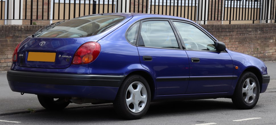 Rear side view of blue sedan with distinctive taillights and alloy wheels