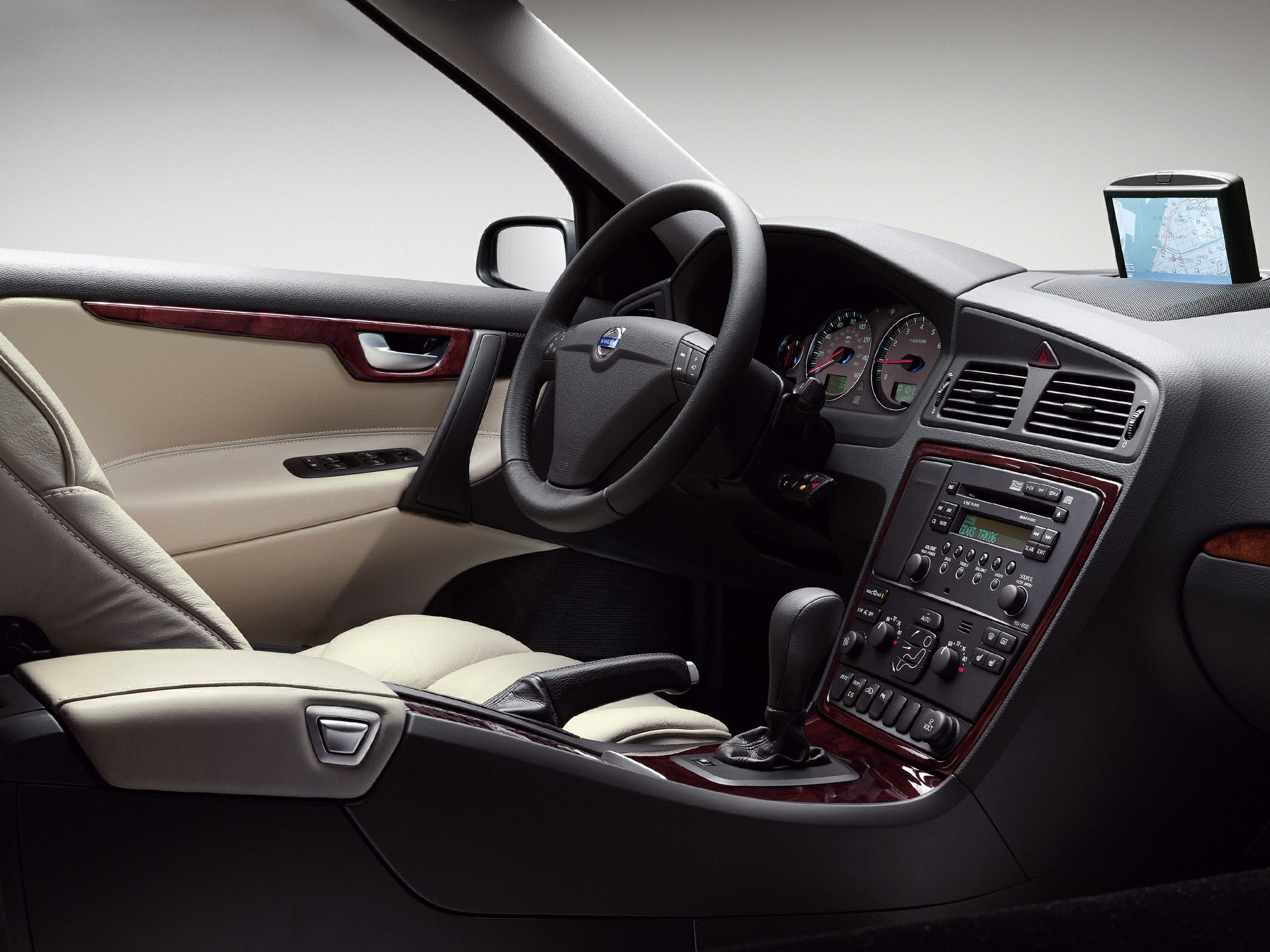 Car interior with navigation system and wood trim dashboard