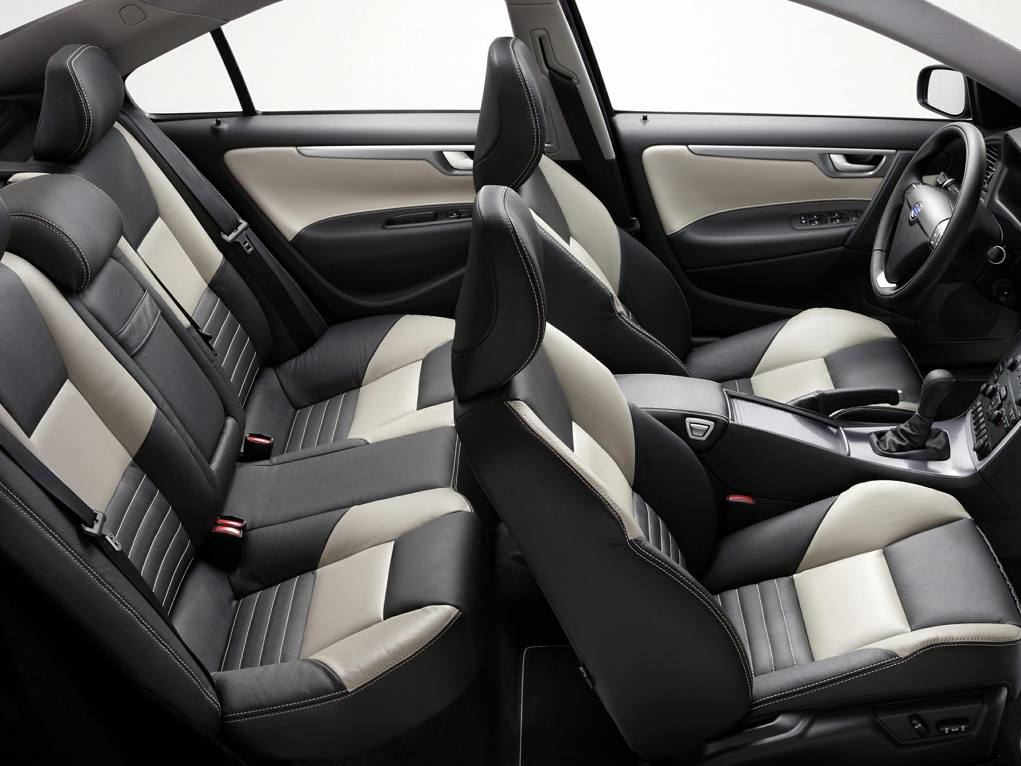 Two-tone leather upholstery with front bucket seats and rear bench seating.