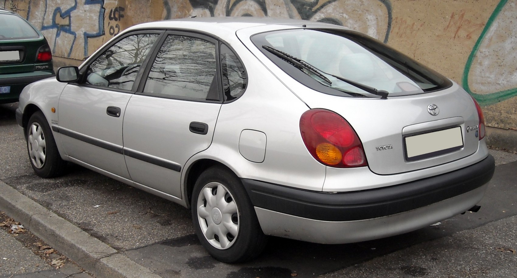 Compact hatchback with rounded rear lights and curved body styling.