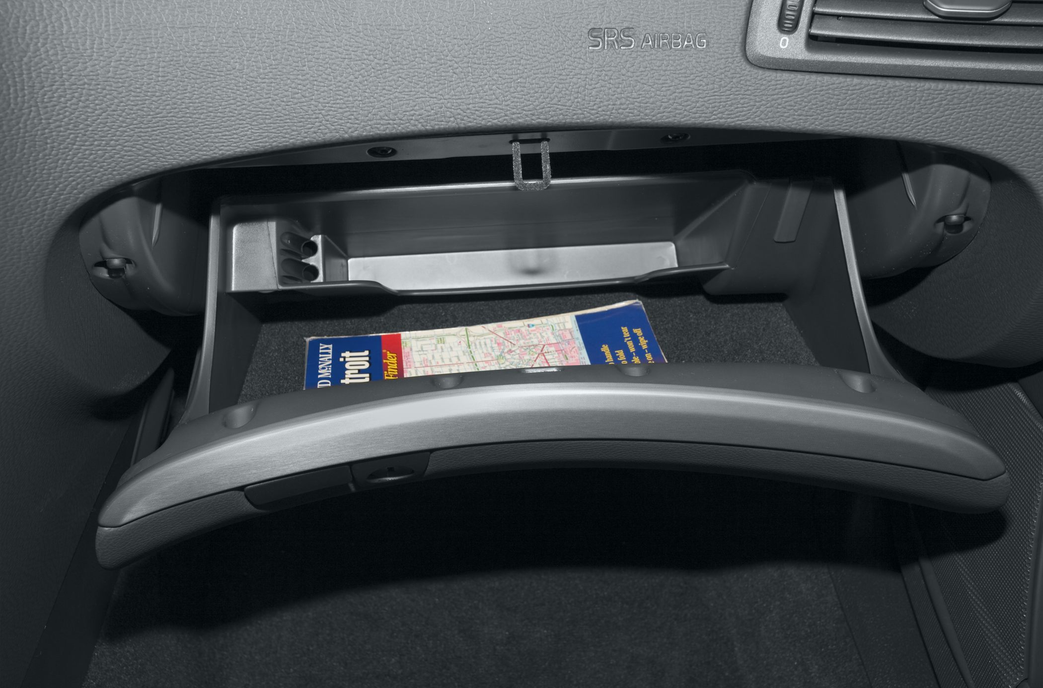 Open glove compartment with interior storage space