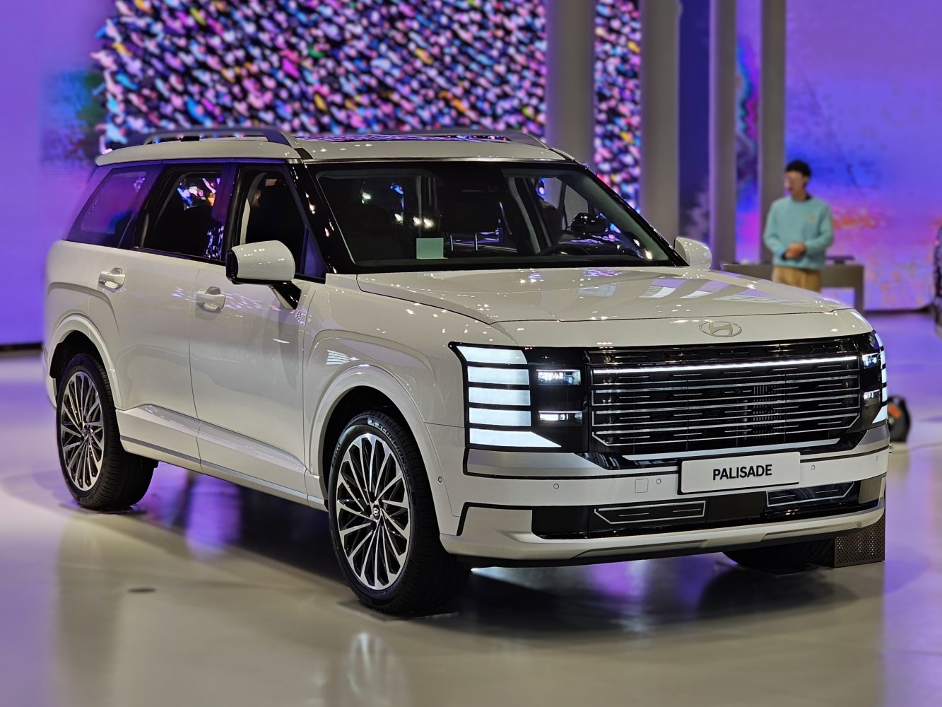 Front and side exterior view with LED headlights and prominent grille