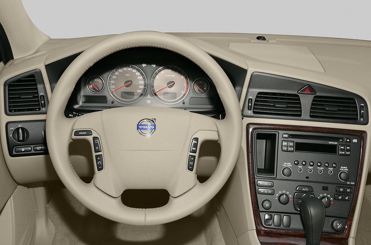 Beige steering wheel and dashboard with central console and instrument cluster