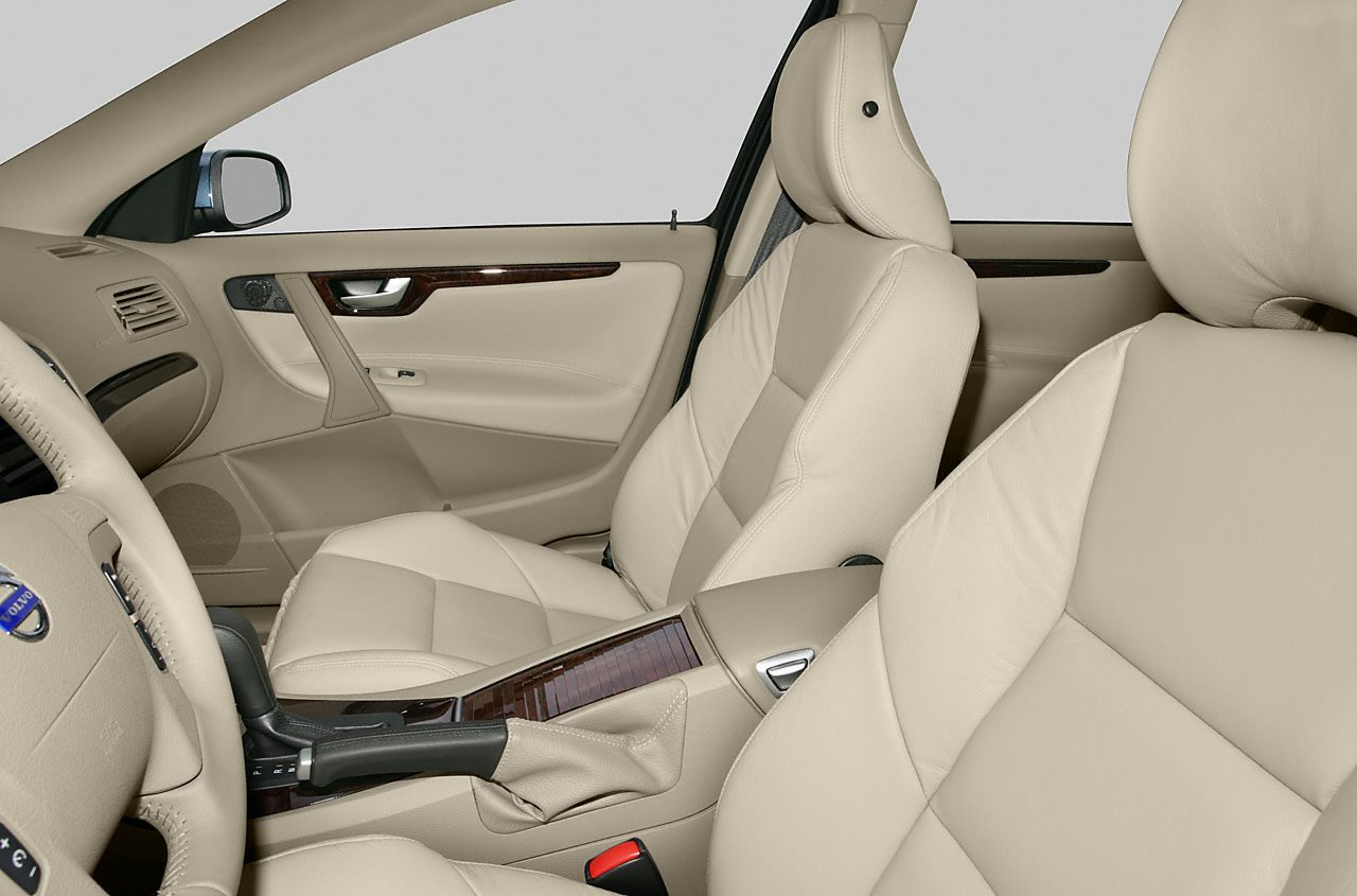 Beige leather seats and wood trim interior with ergonomic design
