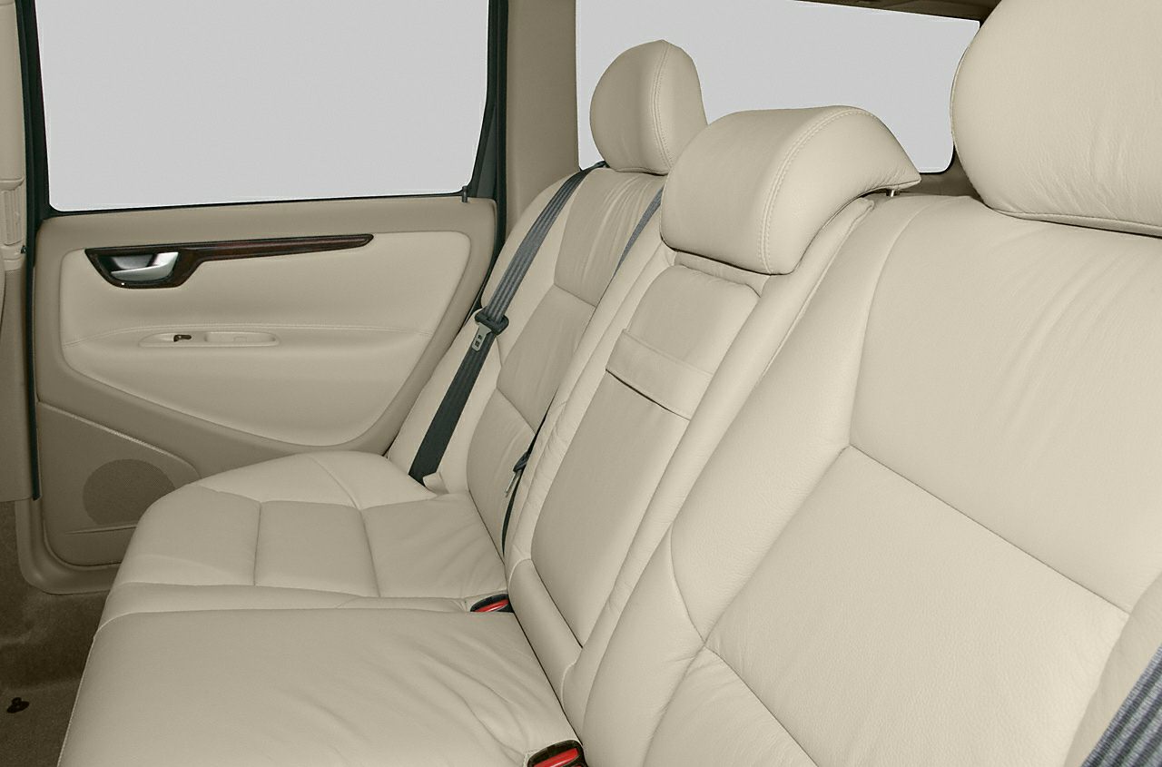Beige leather rear seating with seat belts and door panel