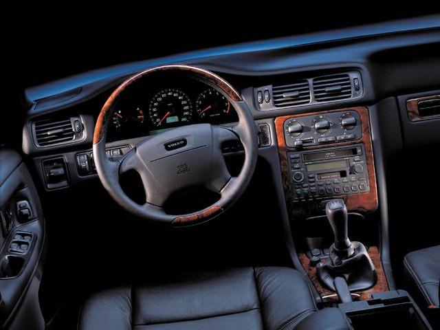 Wood-trimmed steering wheel, instrument cluster, and manual gear shift