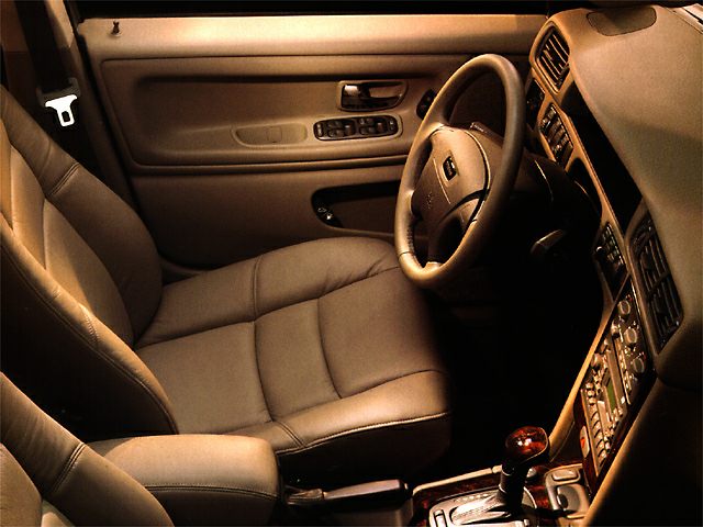 Leather seats, ergonomic dashboard, wood-trimmed gear shift