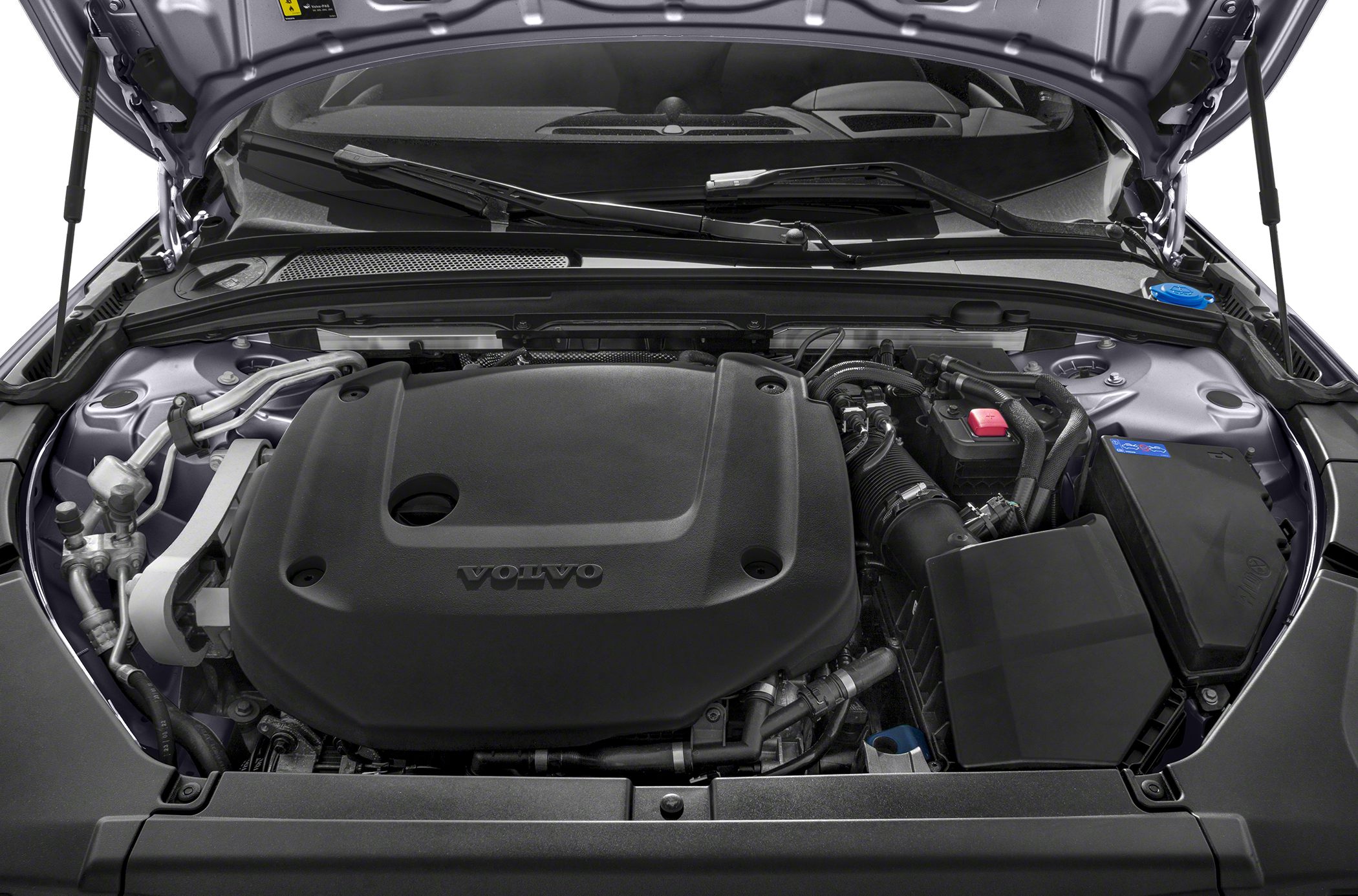 Engine bay with large engine cover and organized component layout