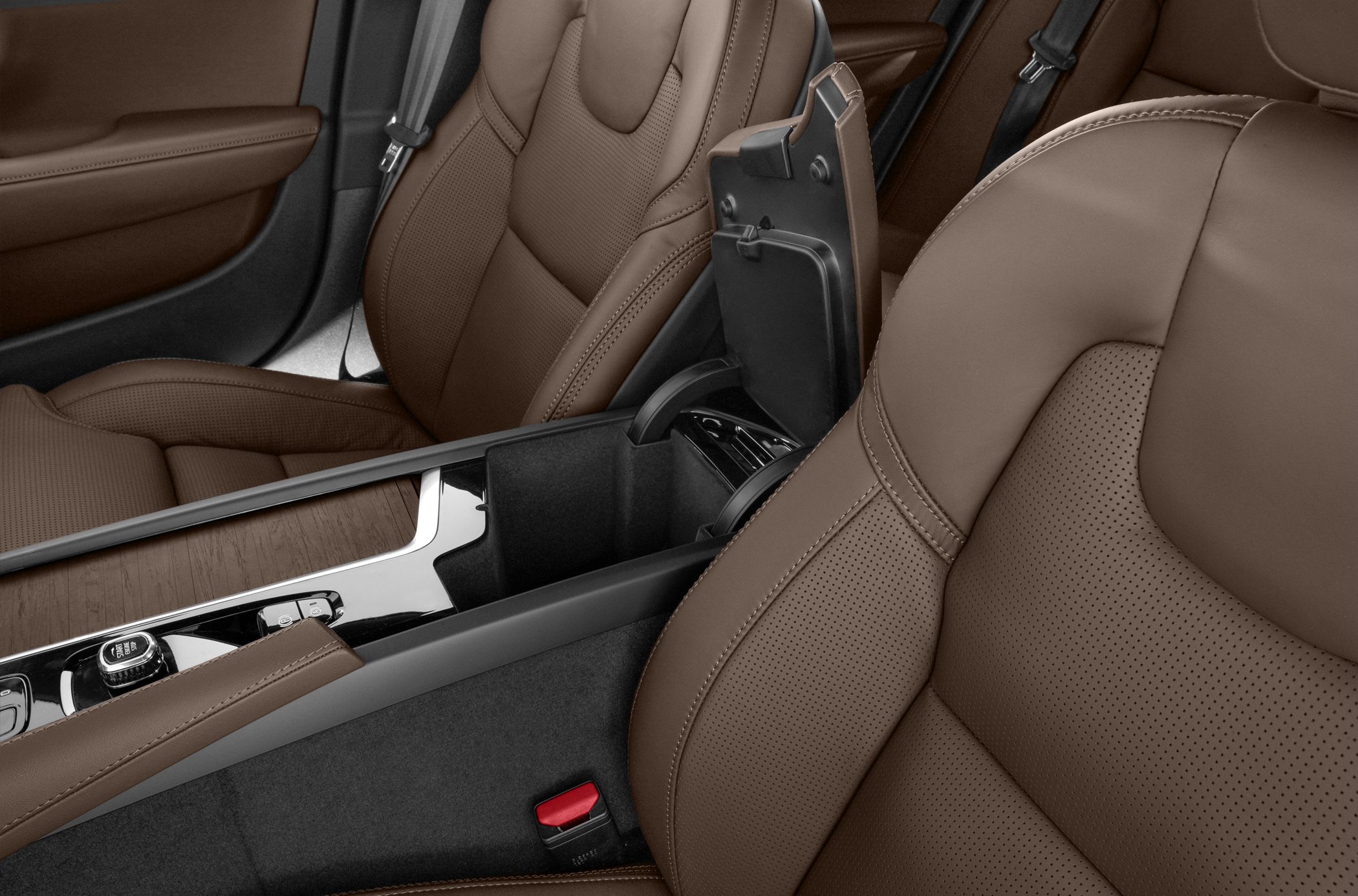 Brown perforated leather seats with central console storage