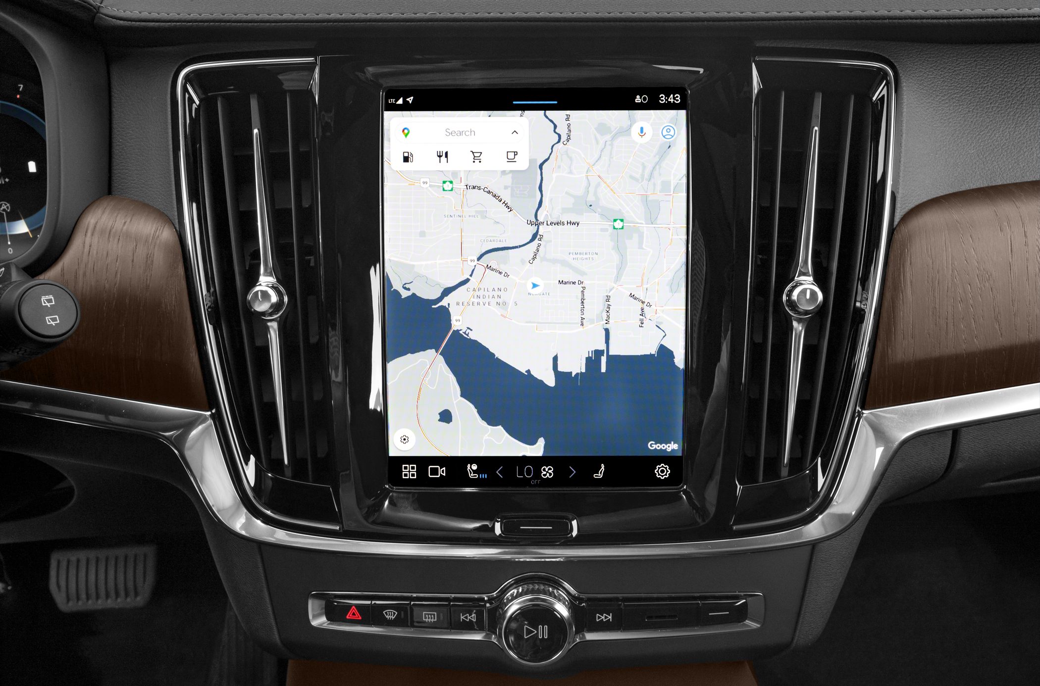 Large central touchscreen with map navigation and sleek vertical air vents.