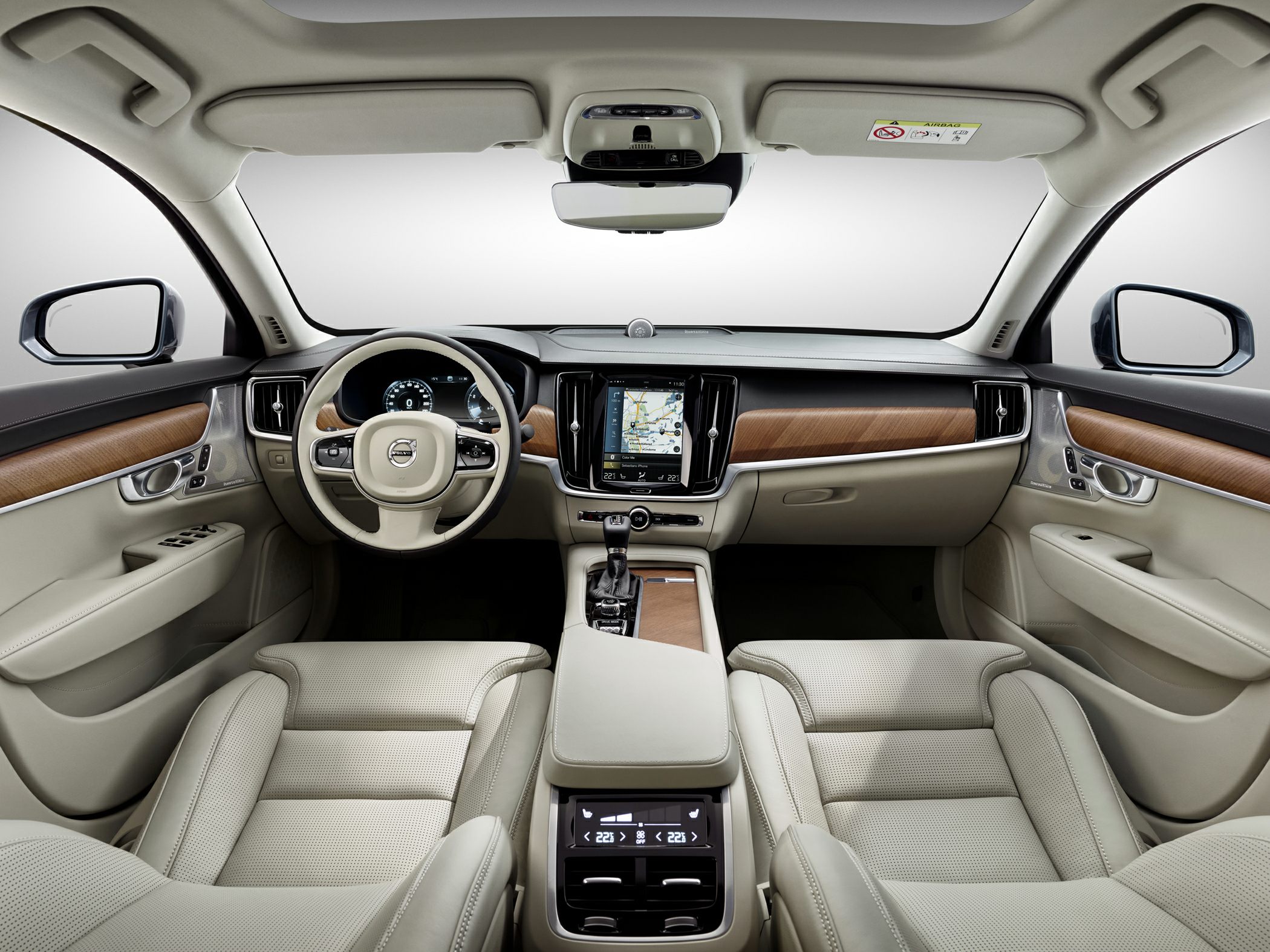 Beige leather seats with wood trim and digital dashboard