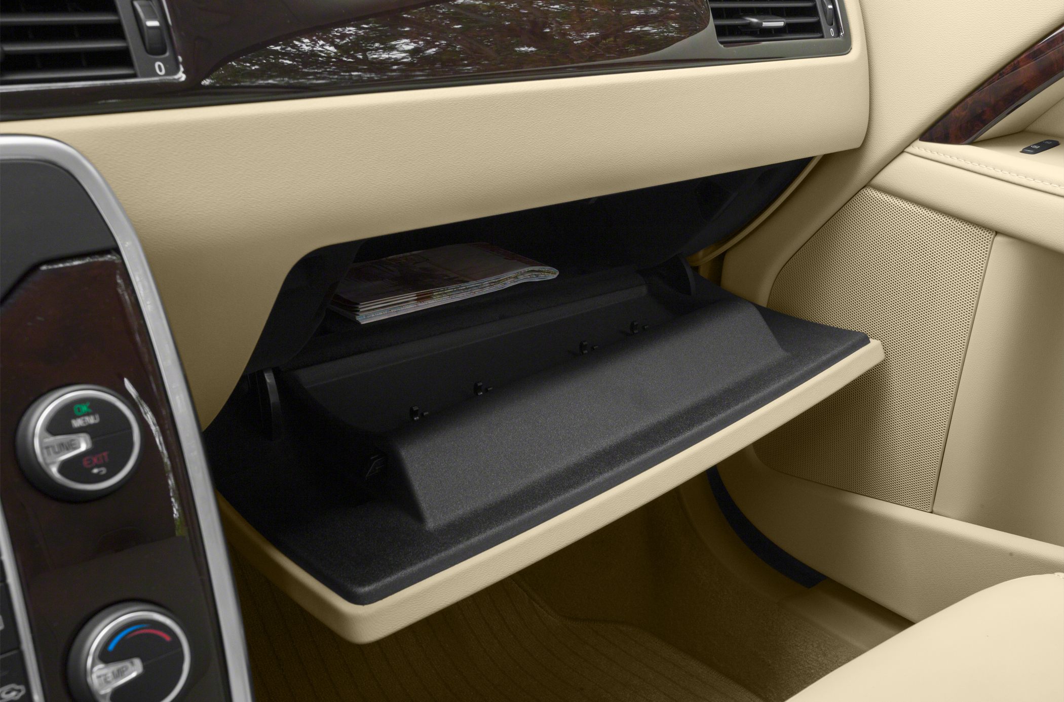 Beige car interior with open glove compartment
