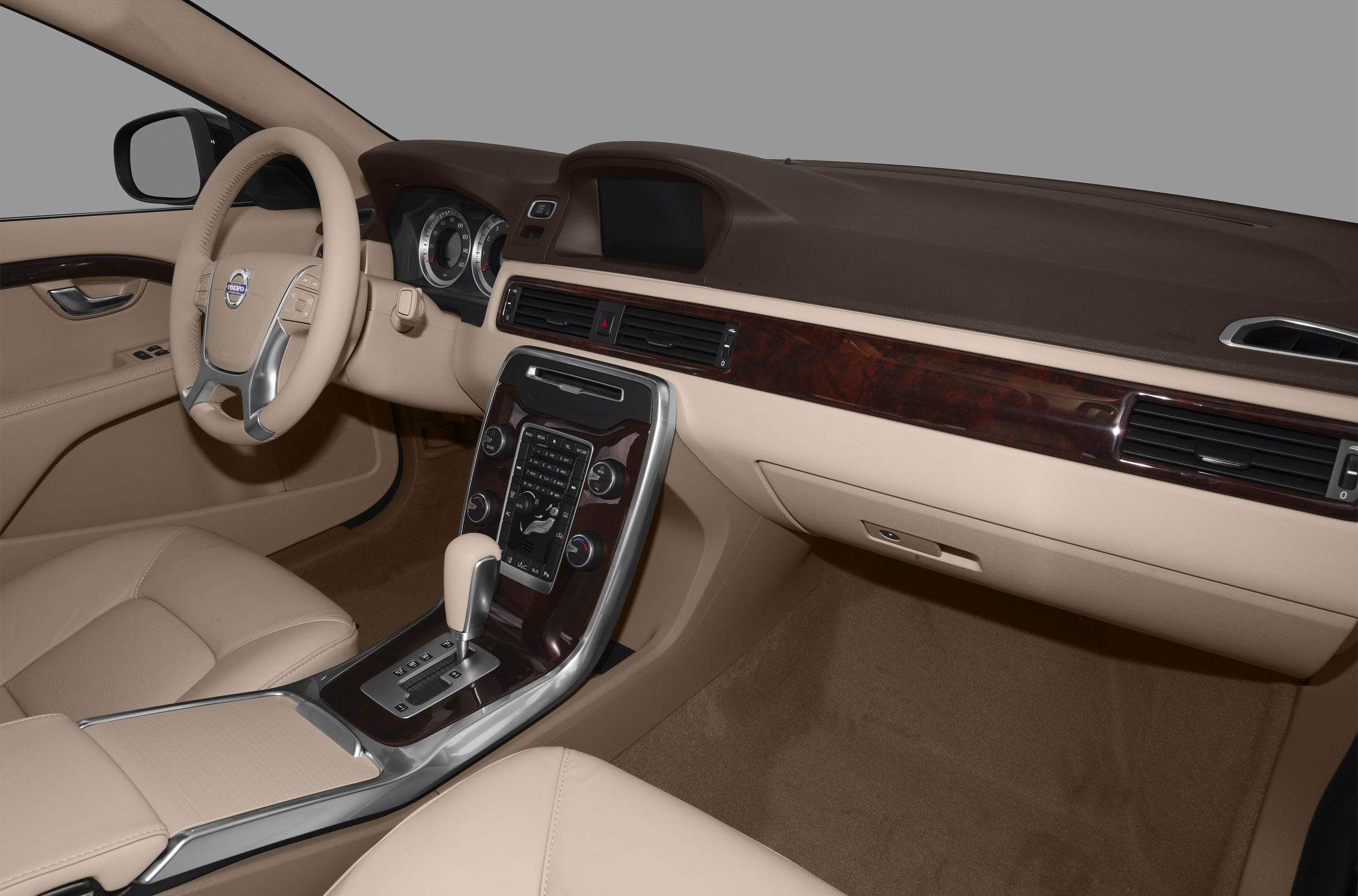 Beige leather interior with wood trim dashboard and automatic gear shift console