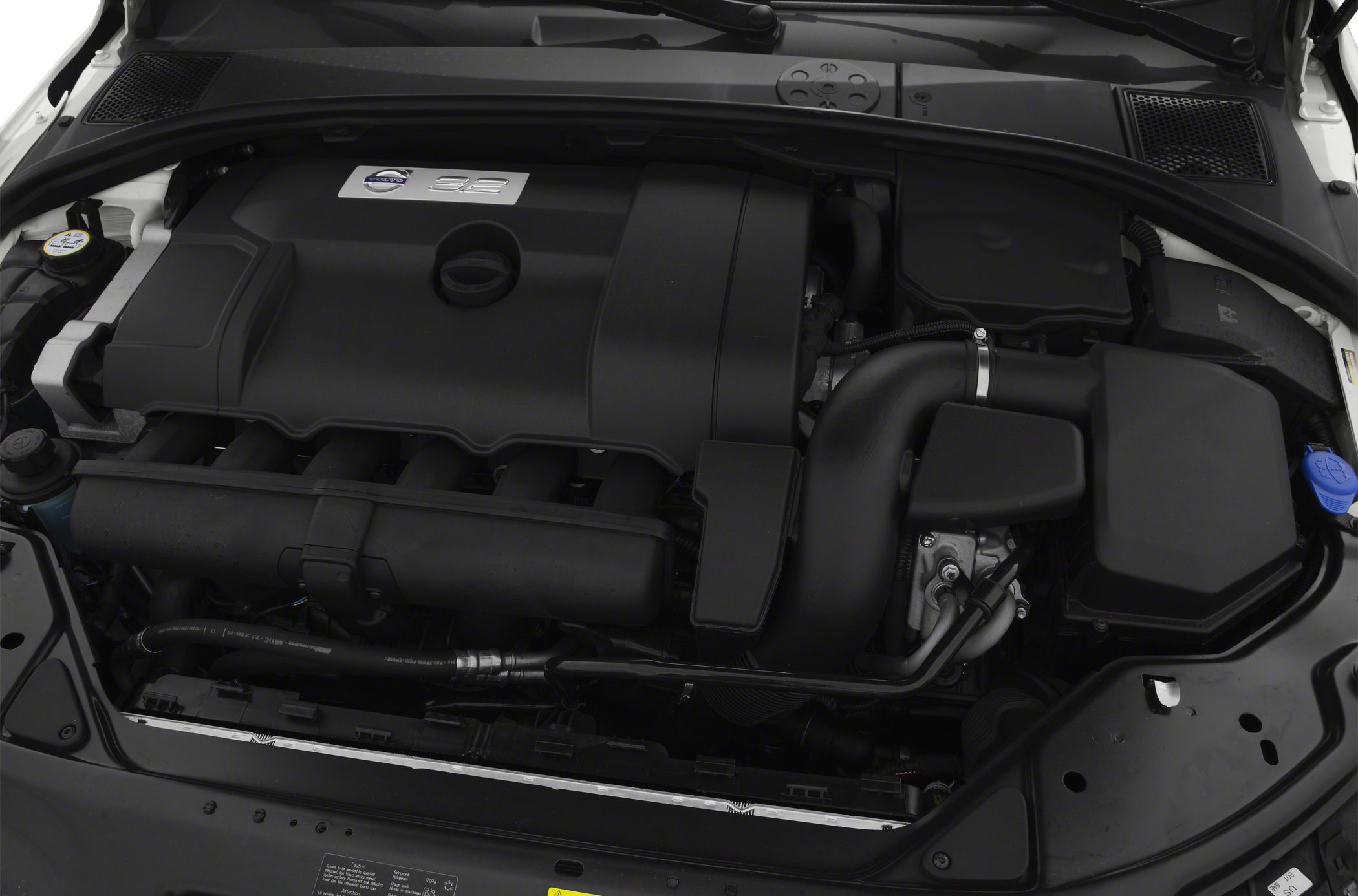 Close-up of engine bay with engine cover and intake components