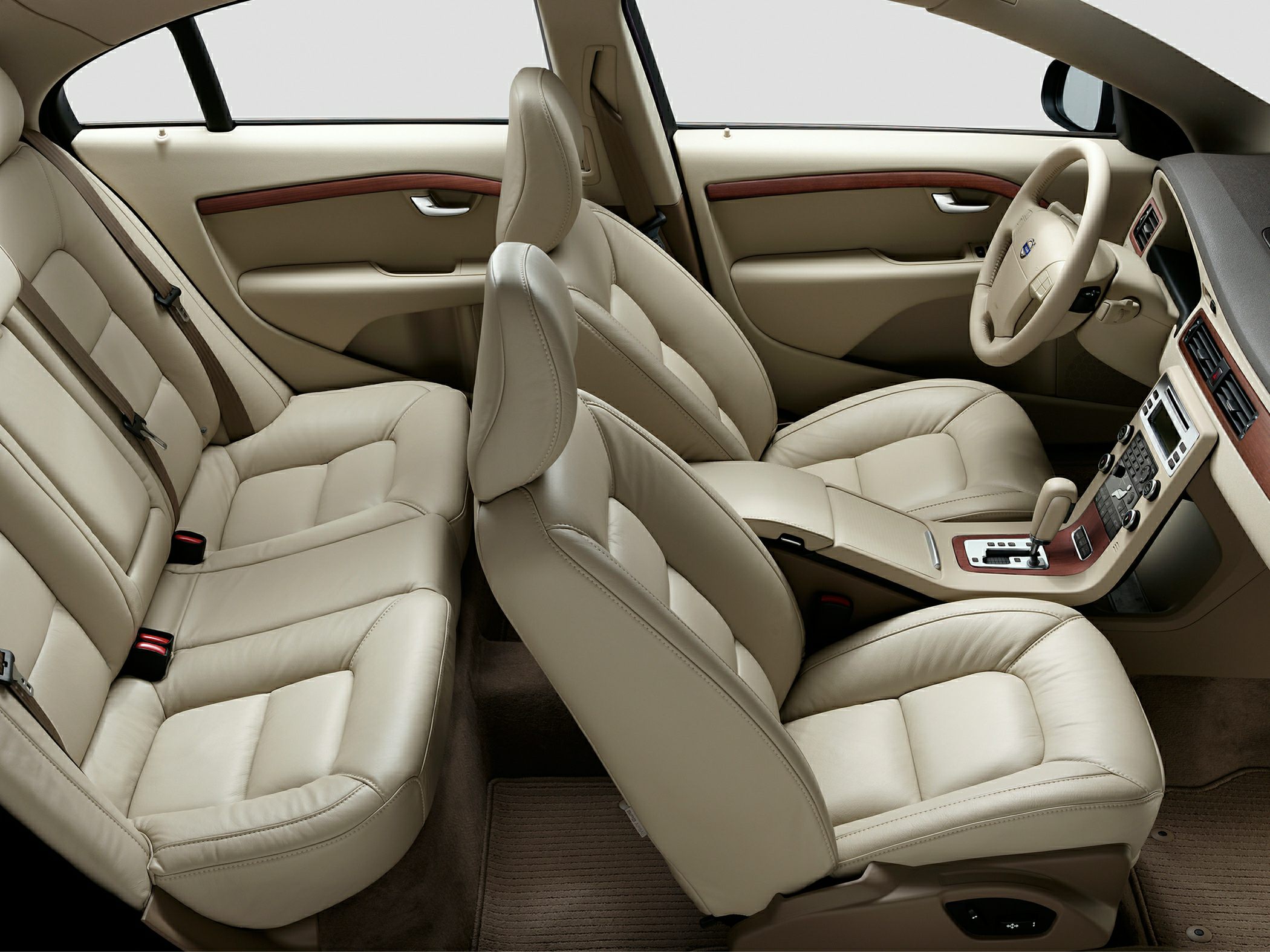 Beige leather seats and wood trim dashboard with automatic gear shift