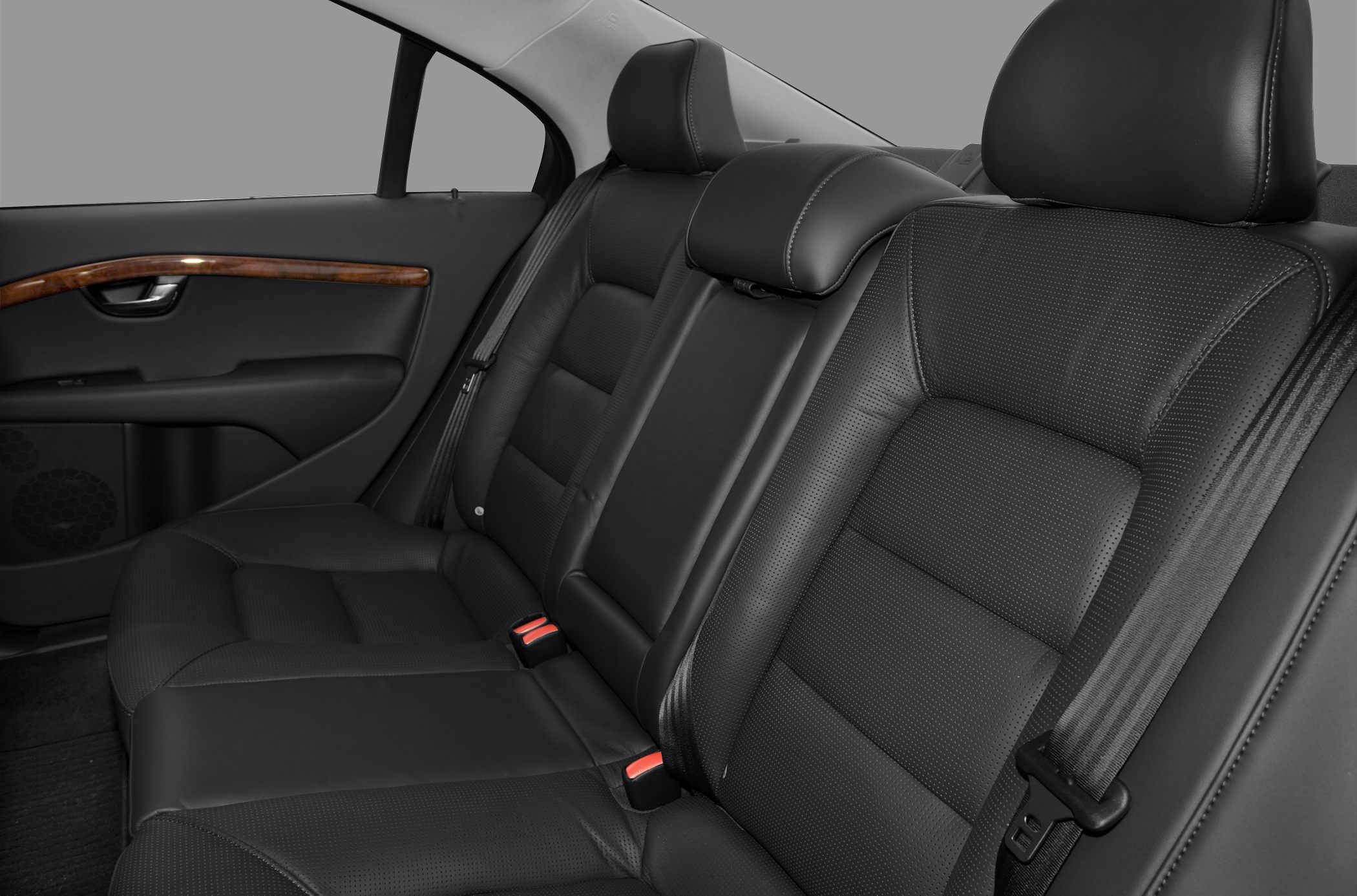 Black leather rear seat with wood trim on door