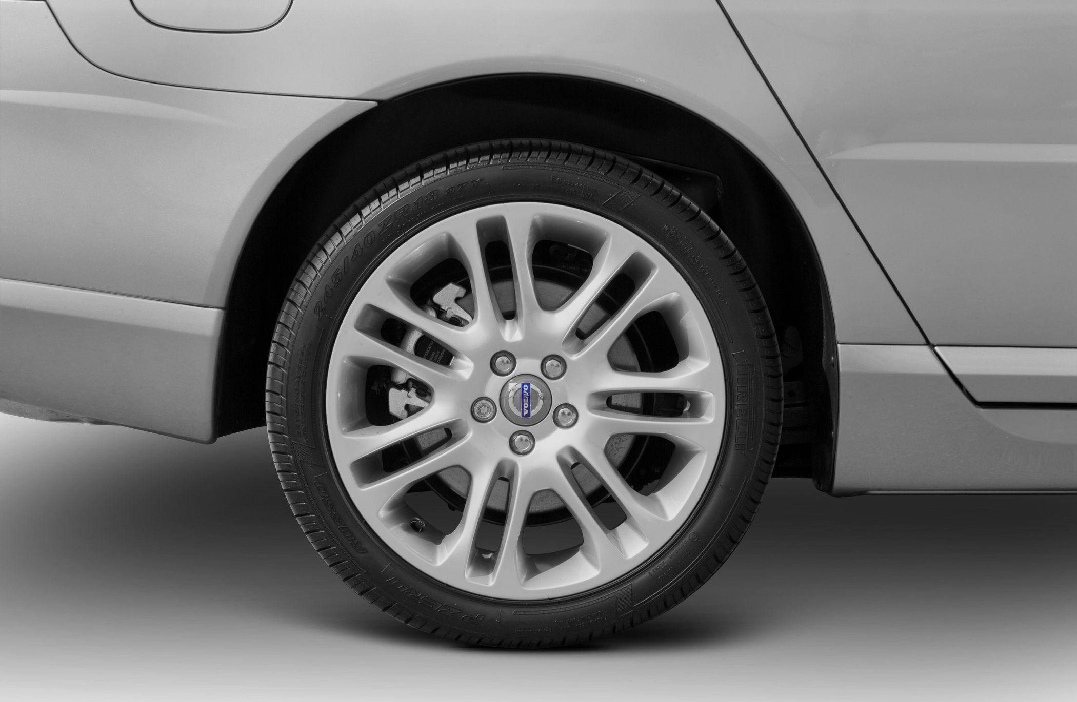 Close-up of alloy wheel and tire on a luxury sedan rear side.