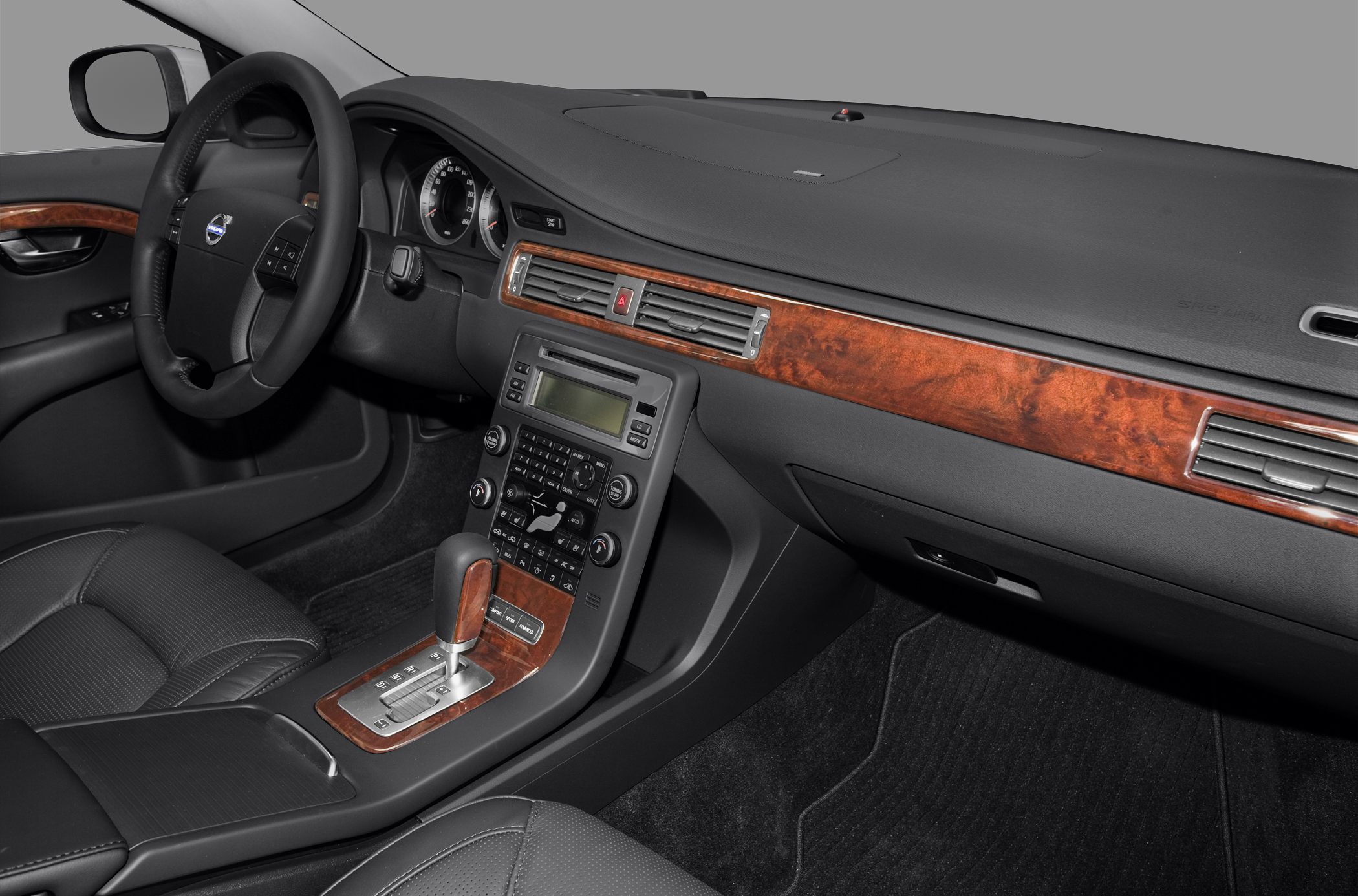 Dashboard and center console with wooden trim and automatic gear lever