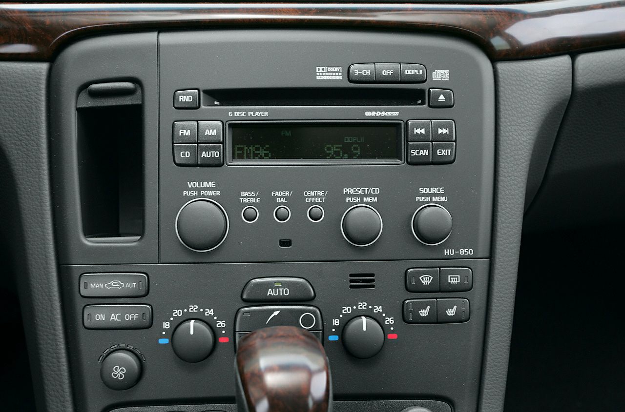 Car audio system and climate control panel with multiple buttons and dials