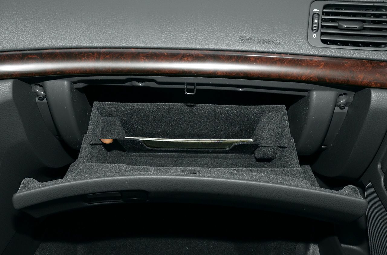 Glove compartment and wood dashboard trim in a car