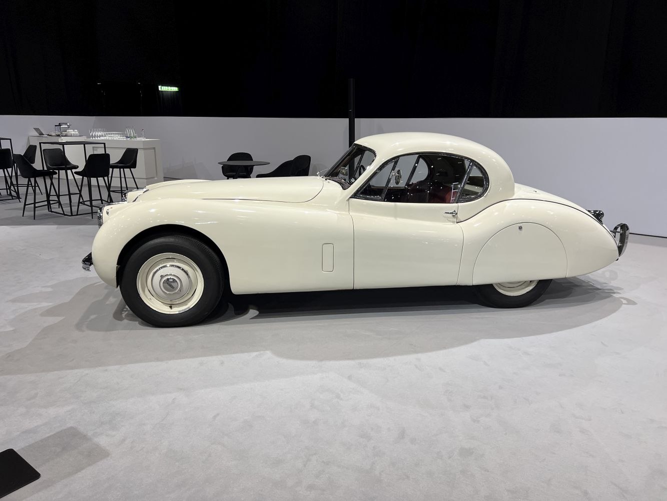 Smooth aerodynamic side view of a vintage coupe with classic rounded lines