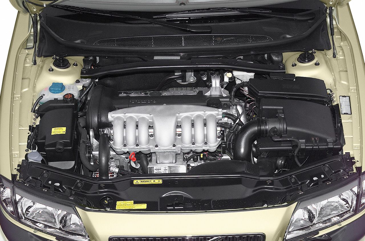 Engine compartment with intake manifold and fluid reservoirs
