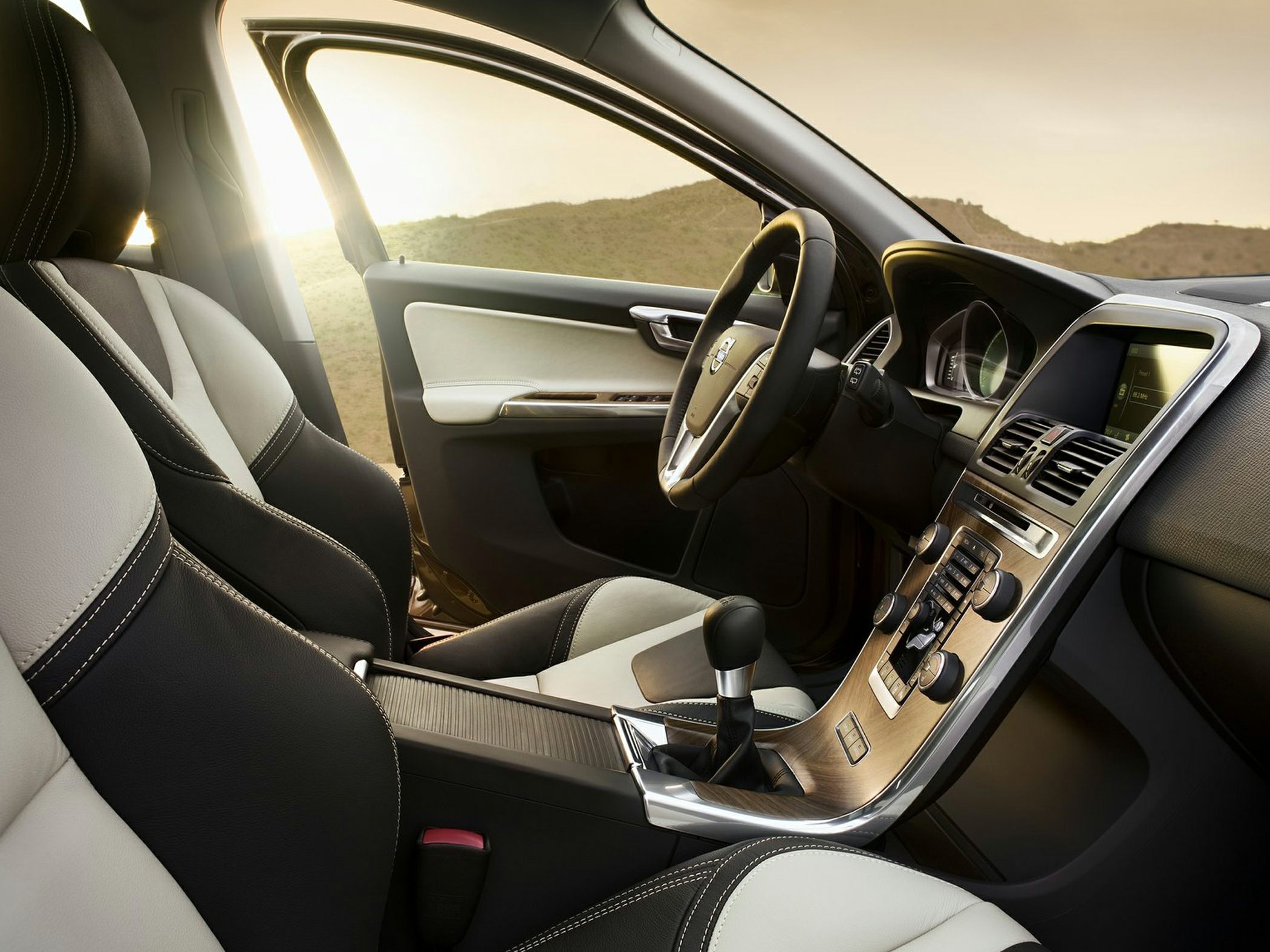 Modern dashboard and premium front seats with wood trim detail
