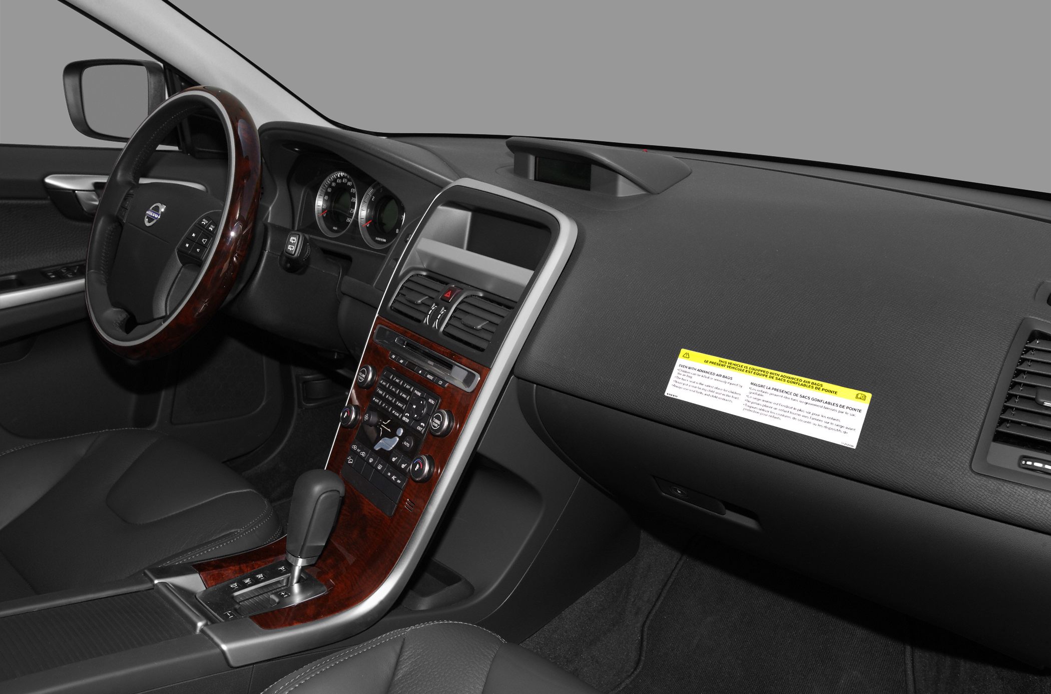 Wood-trimmed dashboard and multifunction steering wheel