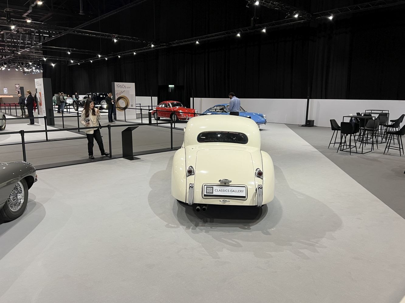 Rounded rear vintage coupe with dual exhausts.