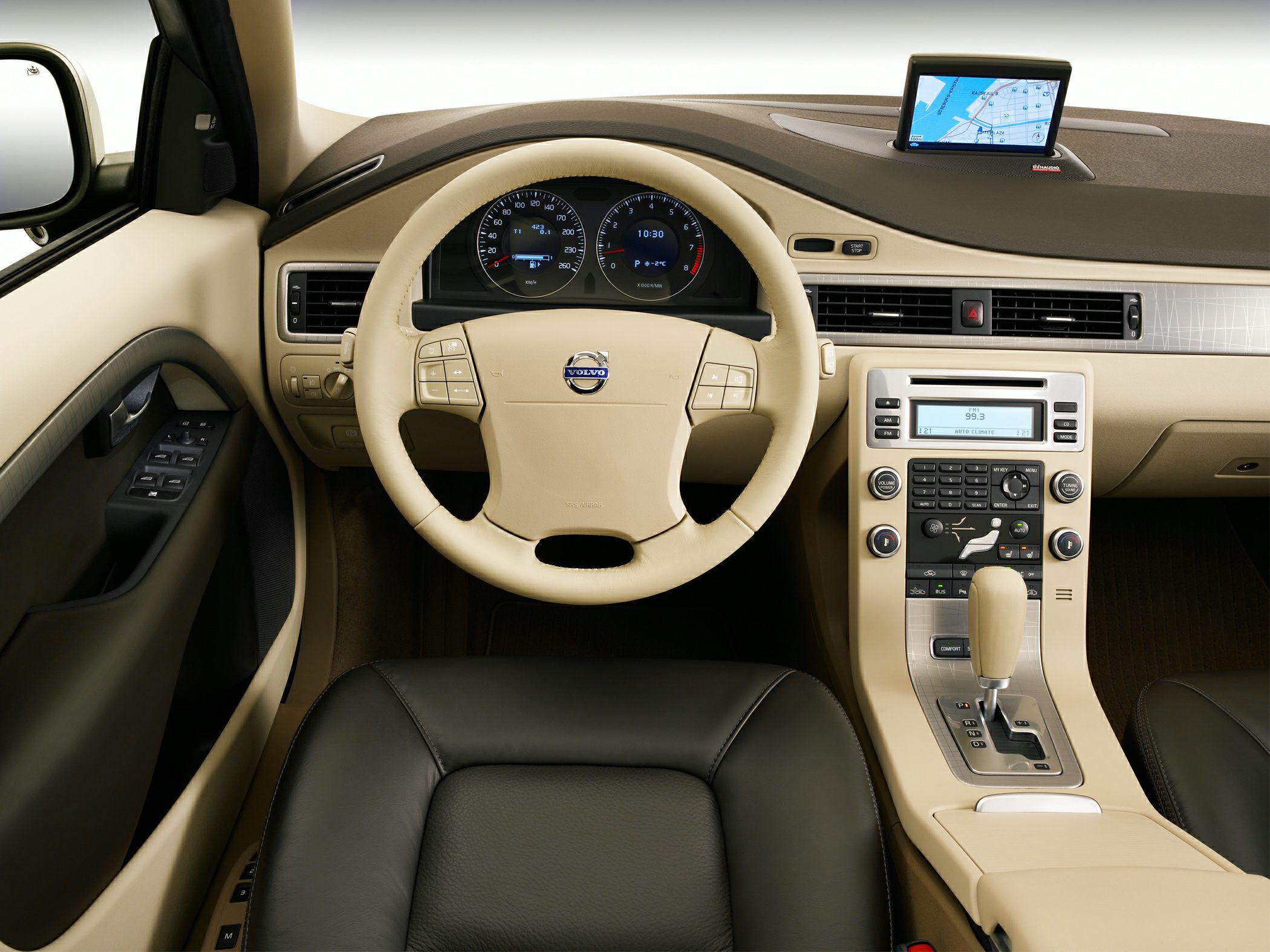 Beige dashboard with steering wheel controls and central navigation display