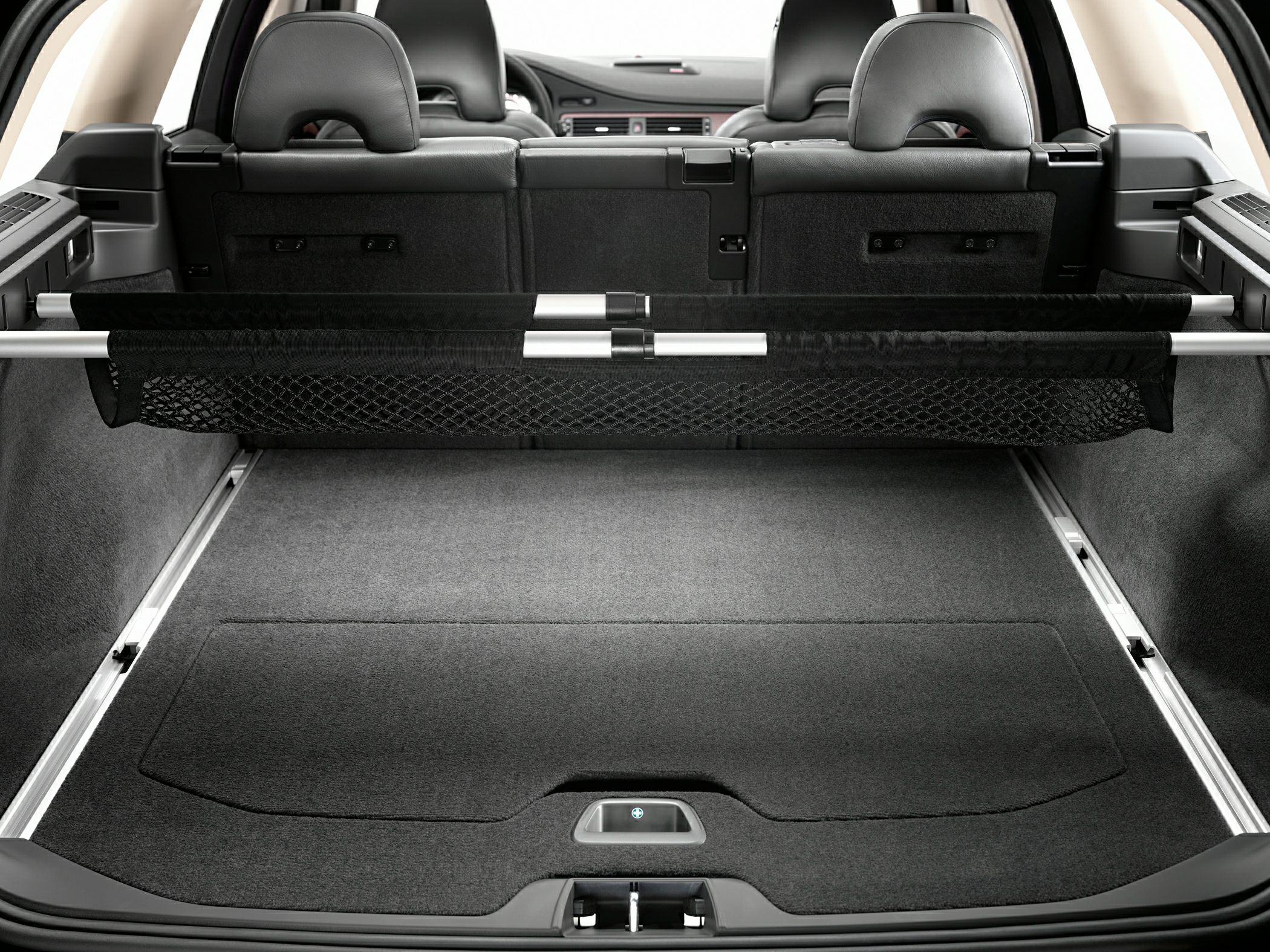 Car rear interior with spacious cargo compartment and foldable seats